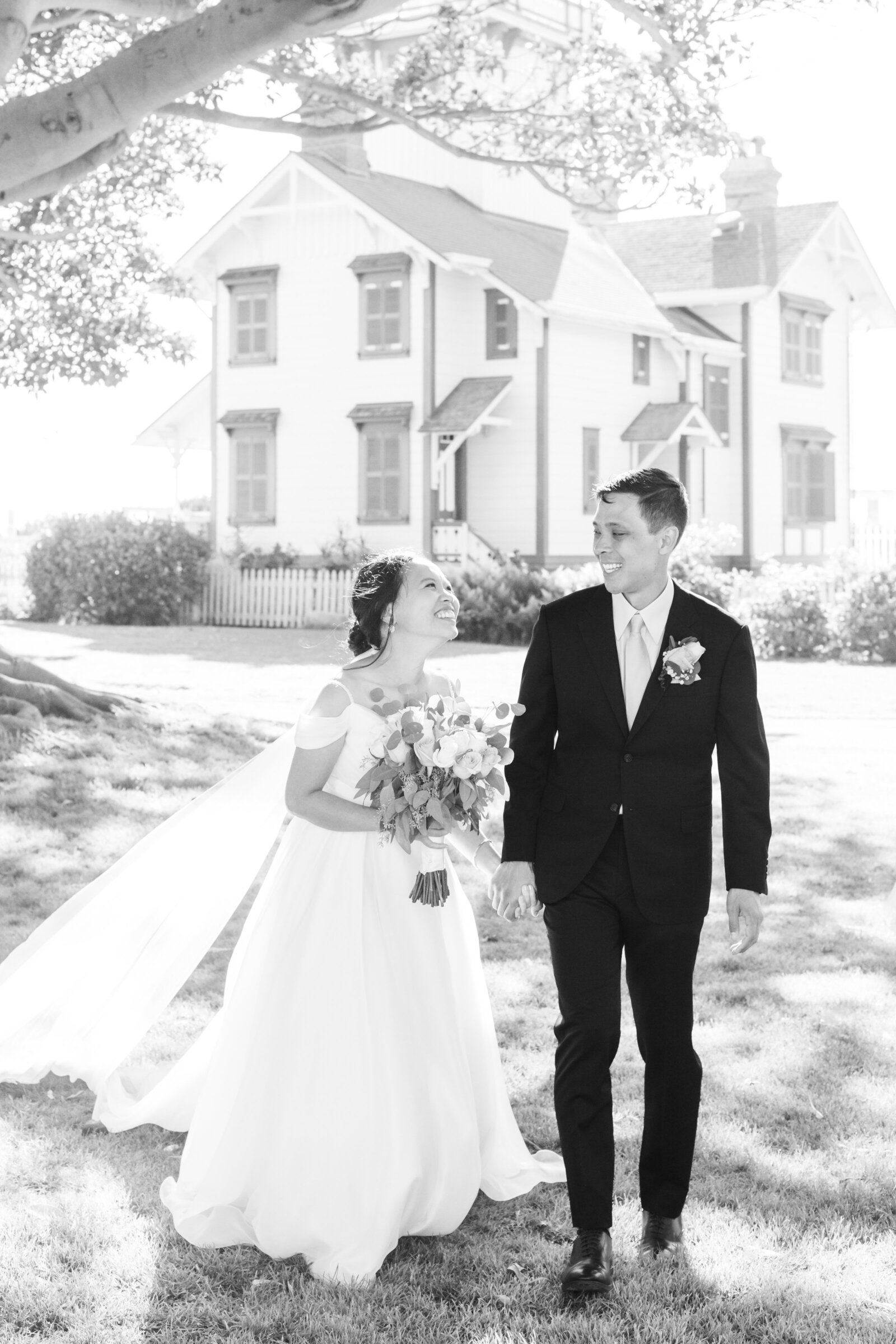 A newlywed couple holds hands after their wedding ceremony in San Pedro, Ca.