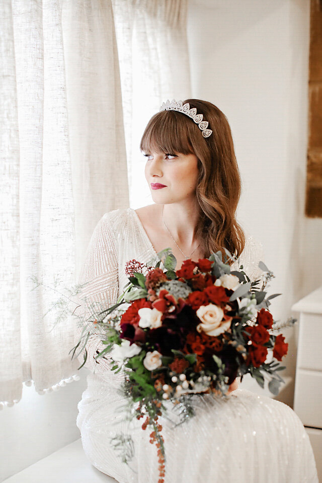 bride-to-be-looking-out-of-window-at-bridal-prep