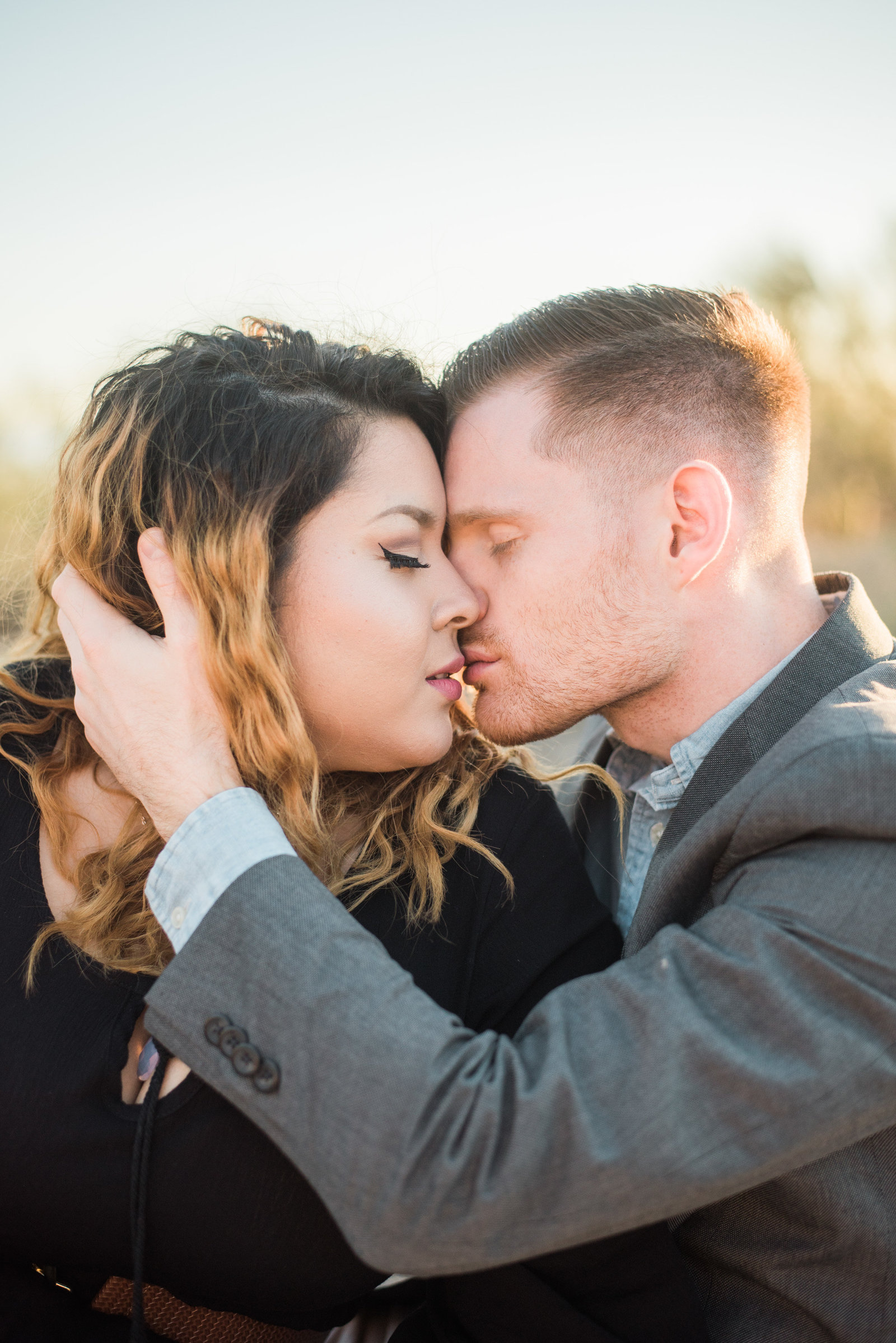 Gates Pass Tucson Desert Engagement Session of Engaged Couple Kissing at Sunset | Tucson Wedding Photographer | West End Photography