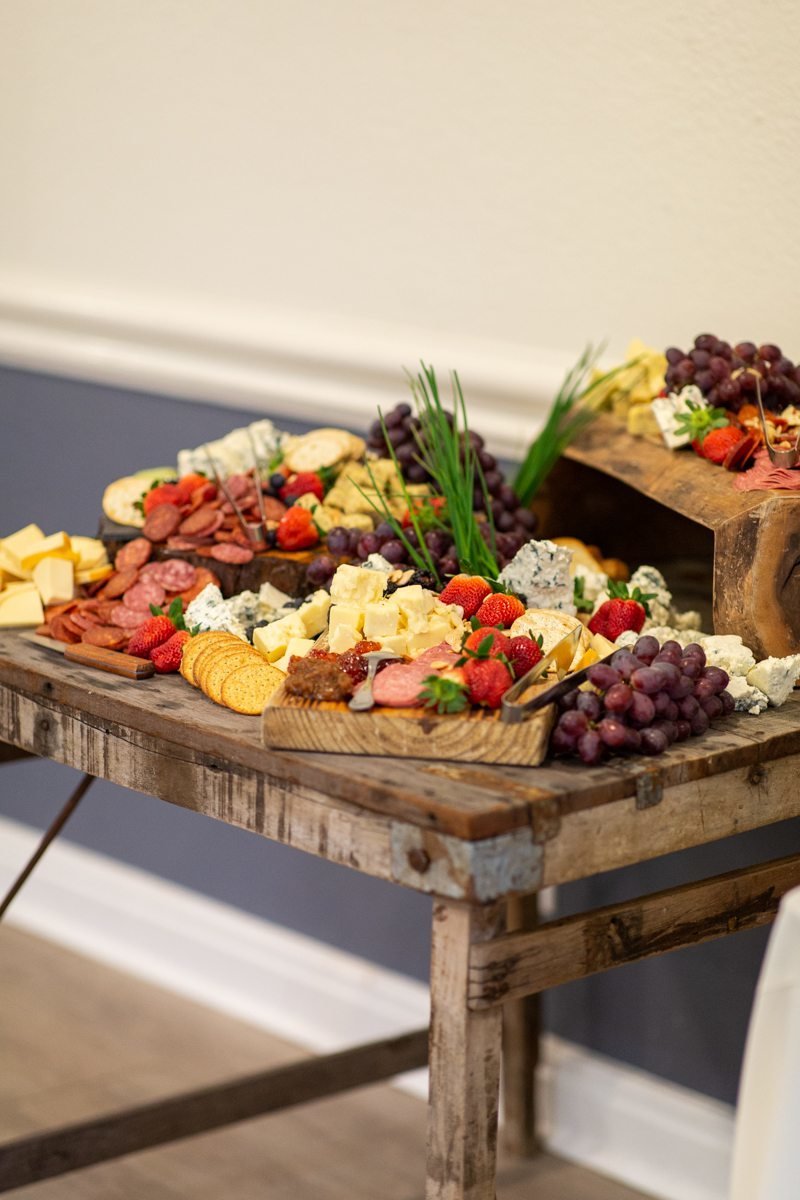 meat and cheese set out for guests at a tasting