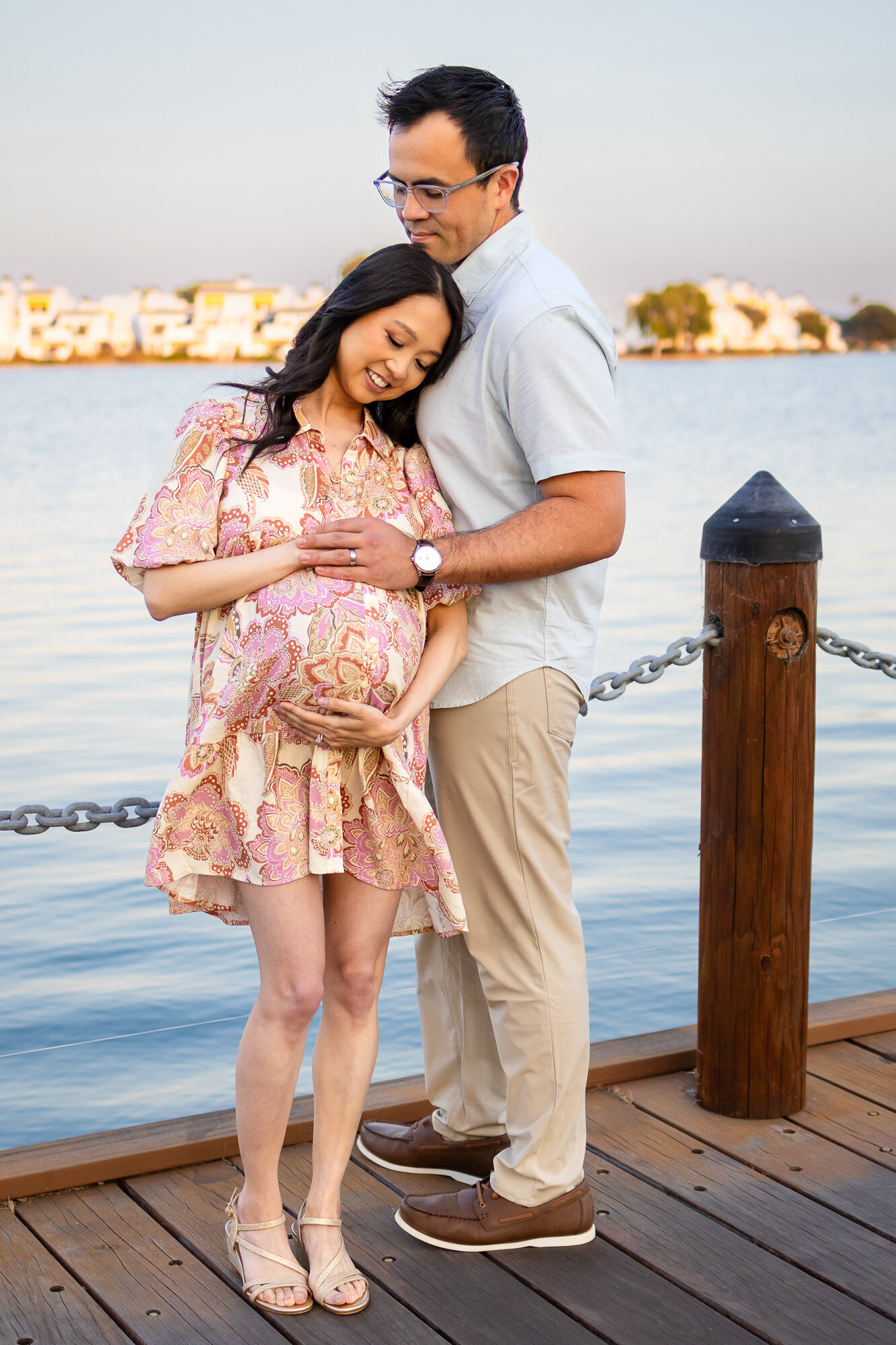 Couple sharing a quiet, loving moment on the dock during their maternity session — Bay Area Maternity Portfolio - Ellobelle Photography