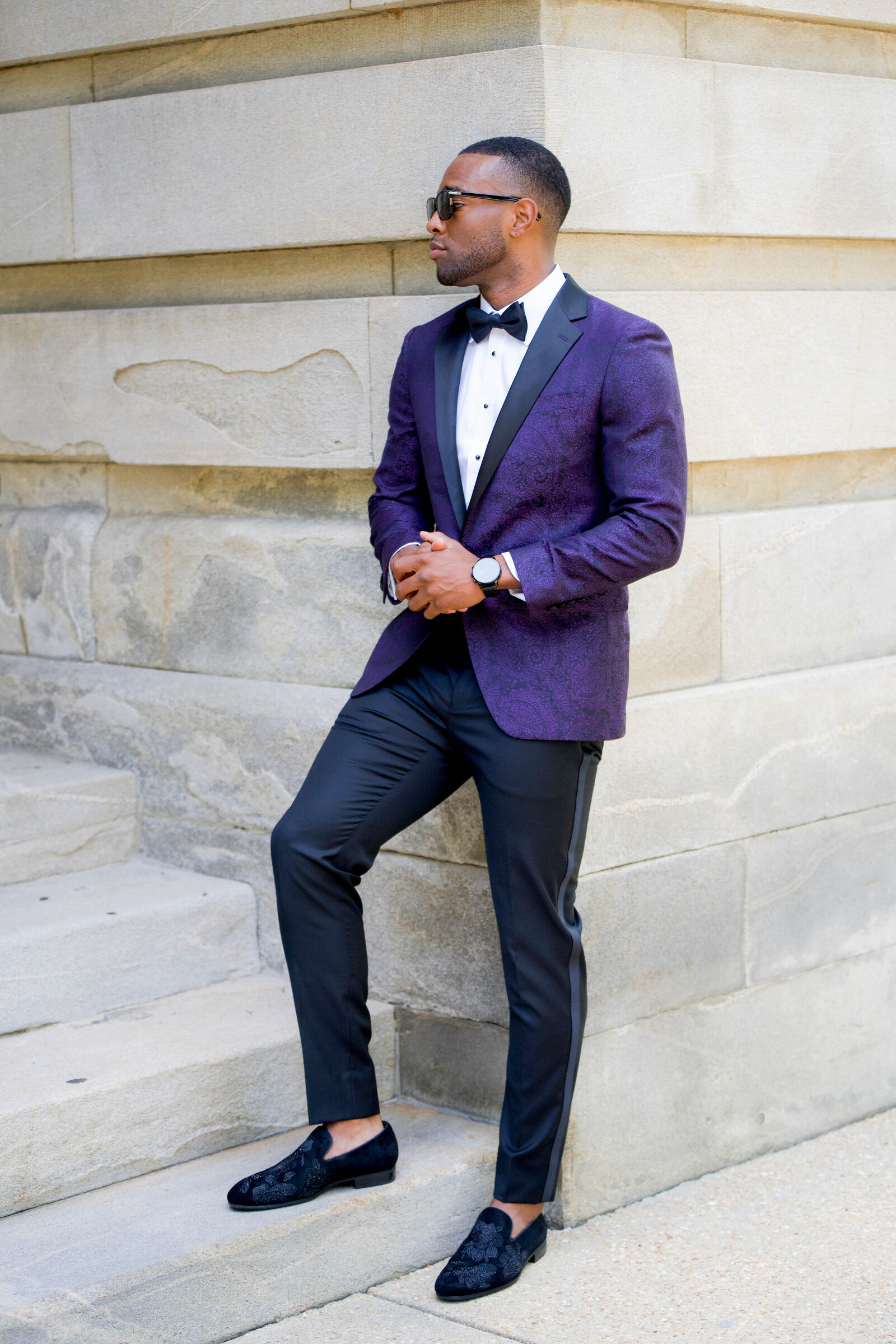 Sharp-dressed groomsmen with the groom in a timeless wedding portrait outside a Raleigh venue.