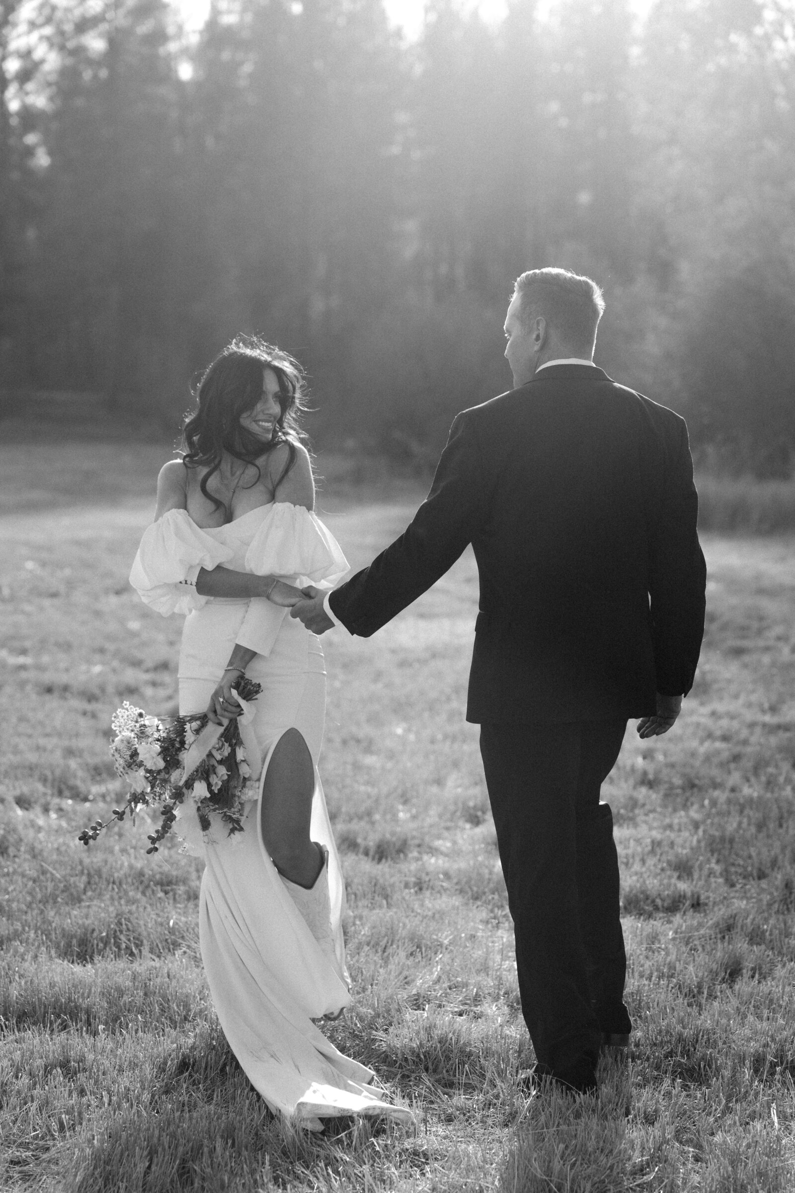 bride and groom in field