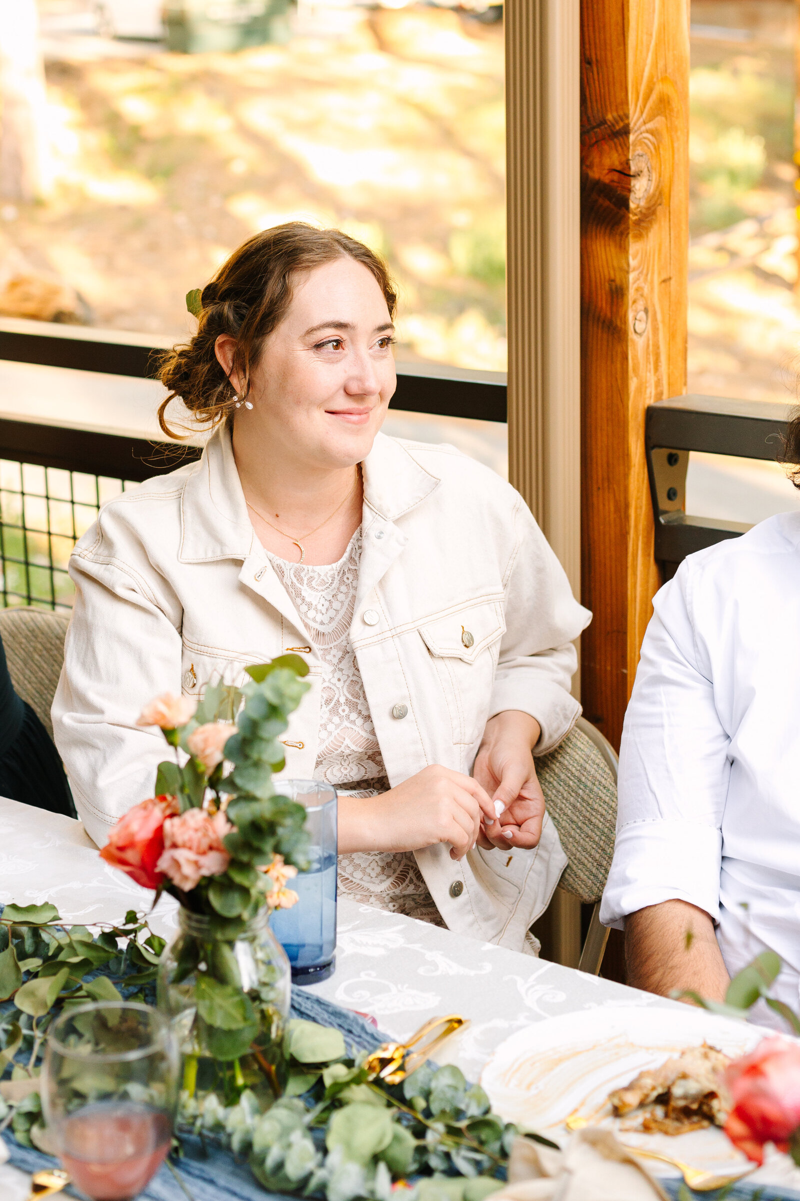 The bridal party celebrates an intimate elopement at a cabin at Big Bear Lake, California.