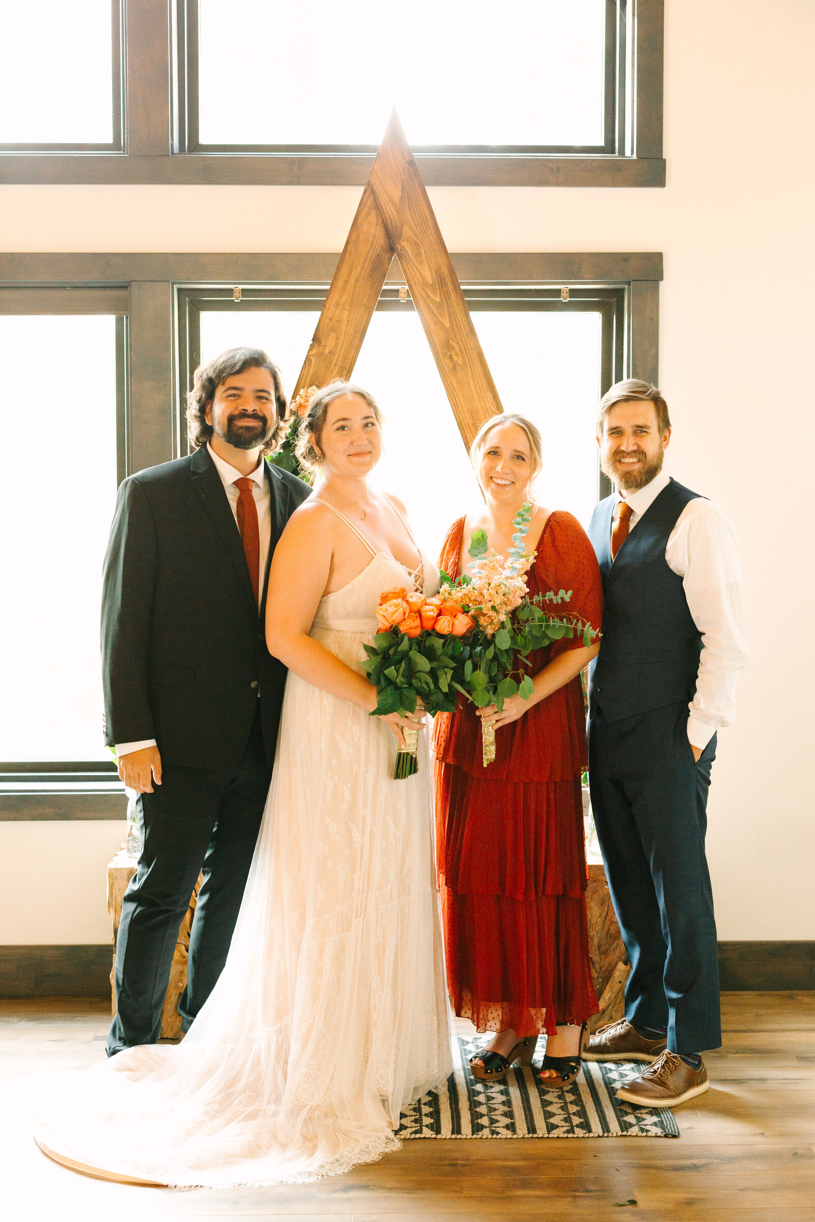 The bridal party celebrates an intimate elopement at a cabin at Big Bear Lake, California.