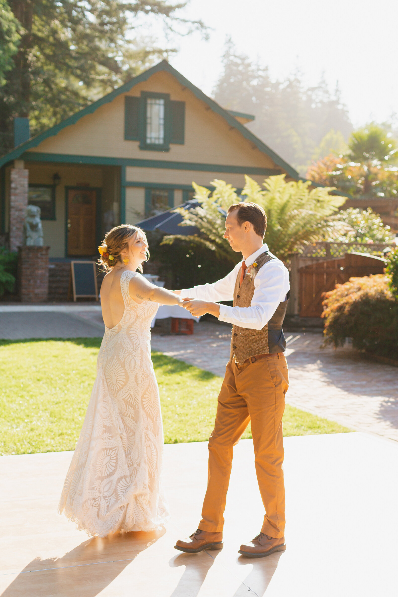 Bride and groom on their colorful wedding day in Santa Cruz, California in the redwood trees.