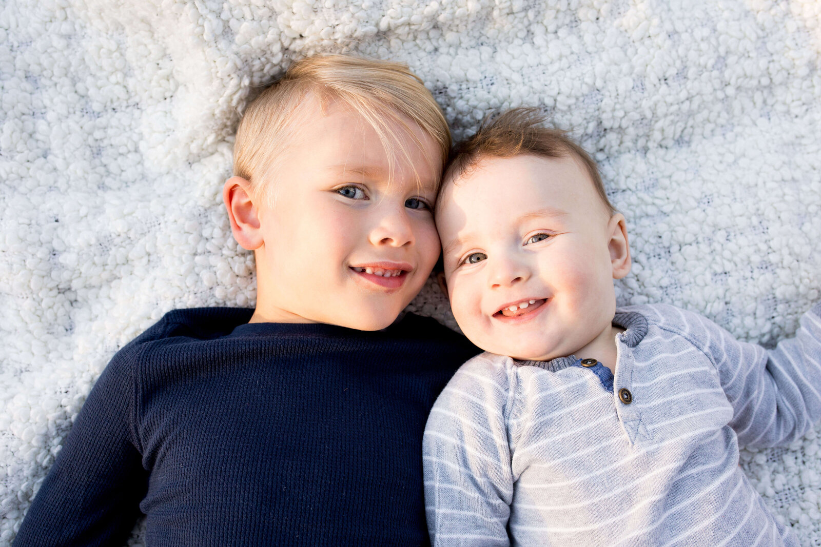 Oldest and youngest brothers smile for the camera.