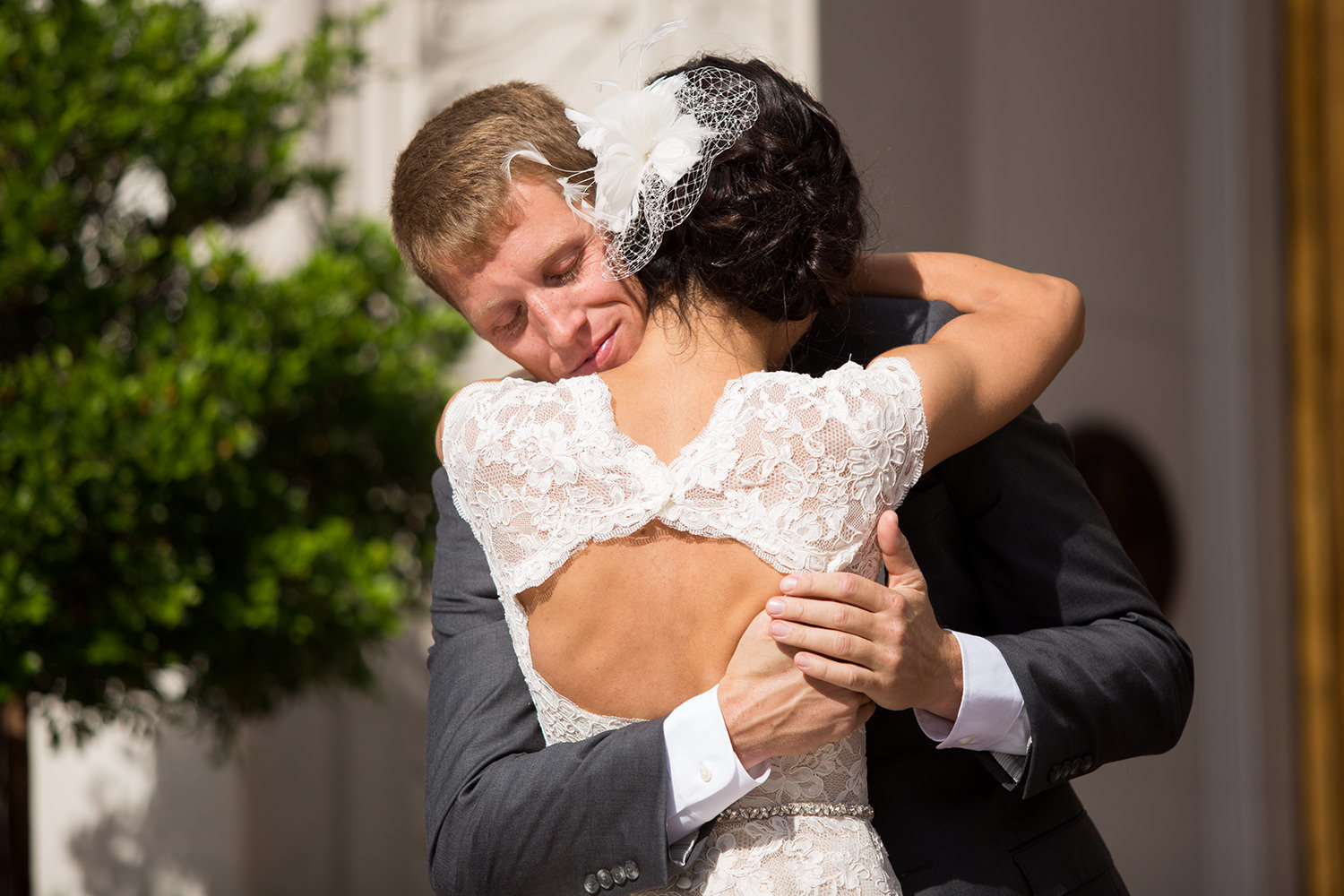 groom hugging bride at their first look