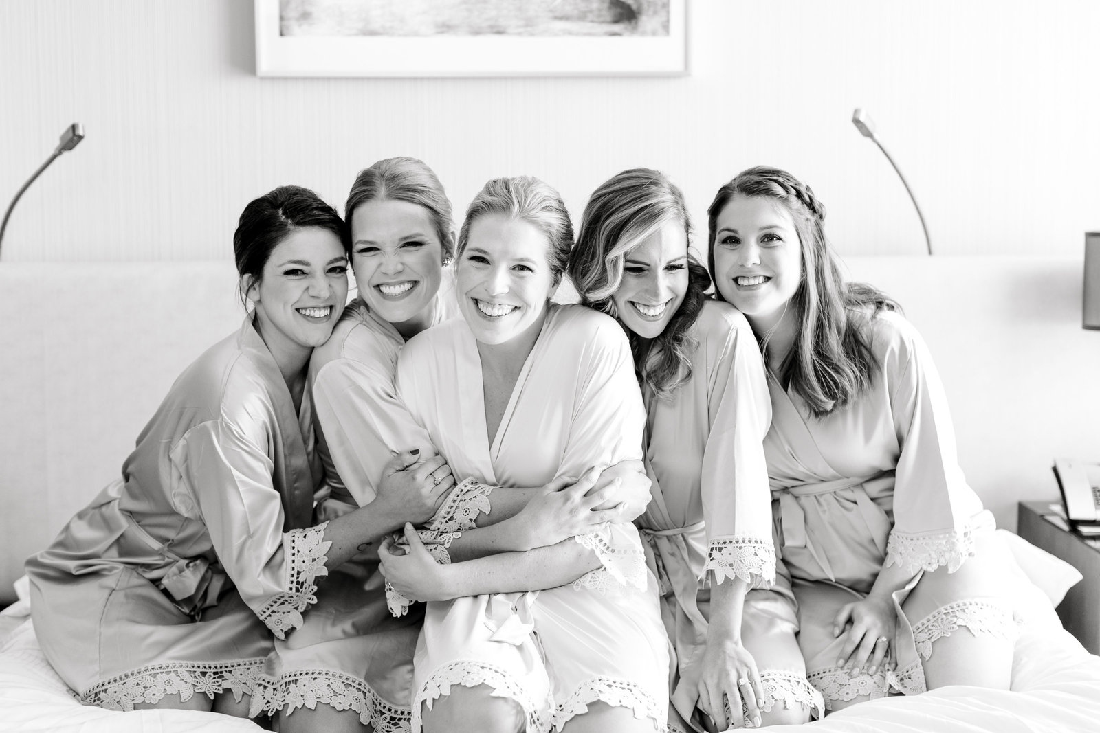 bridesmaids hug bride at the westin in cleveland