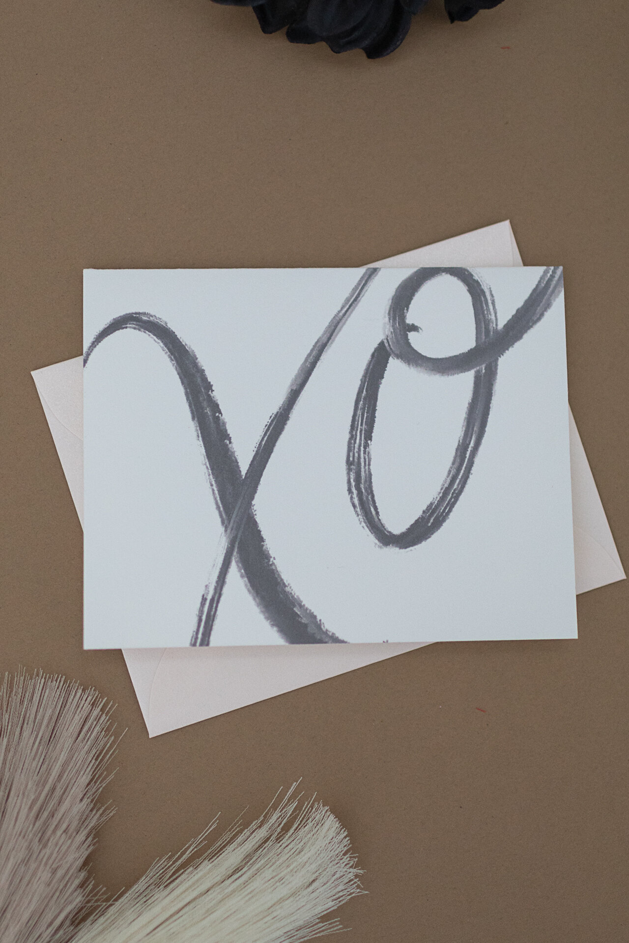 Flatlay image of card that says XO