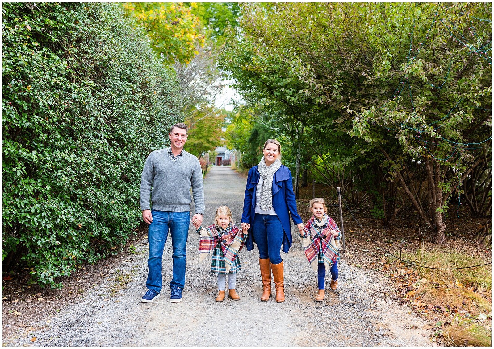 couple with two kids walking with fall outfits on