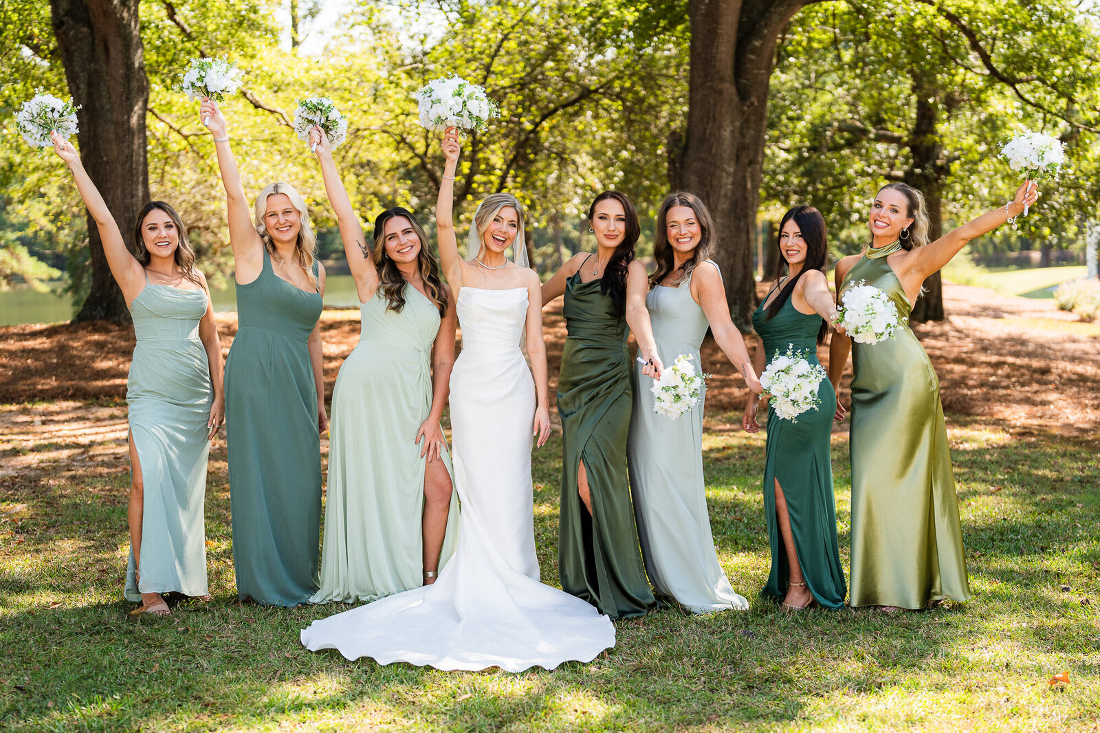 bride and bridesmaids cheering during the bridal party formals at the venue at Daisy Hill