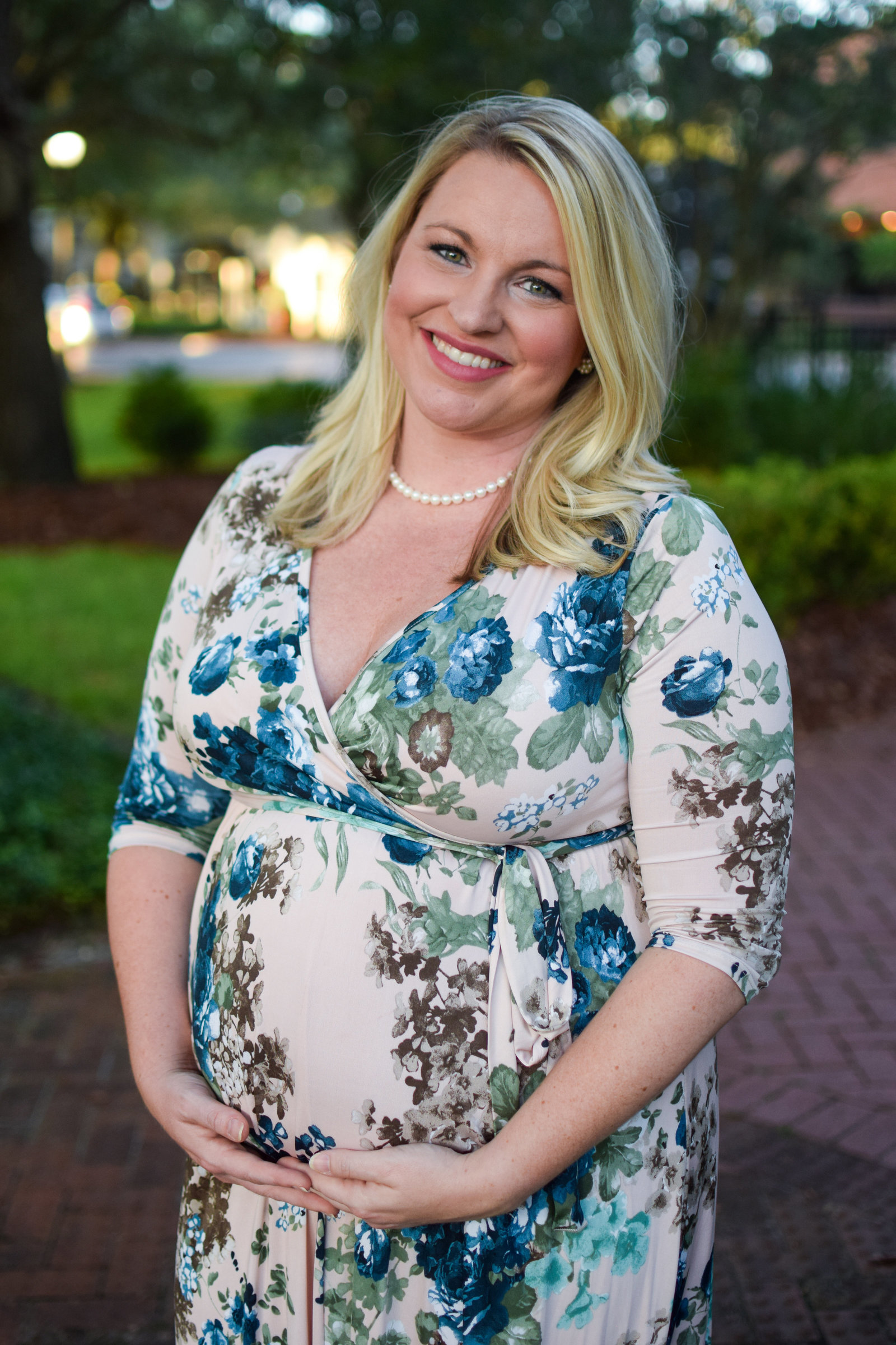 Maternity Pregnant Girl holding baby bump floral maxi dress  Windermere Florida