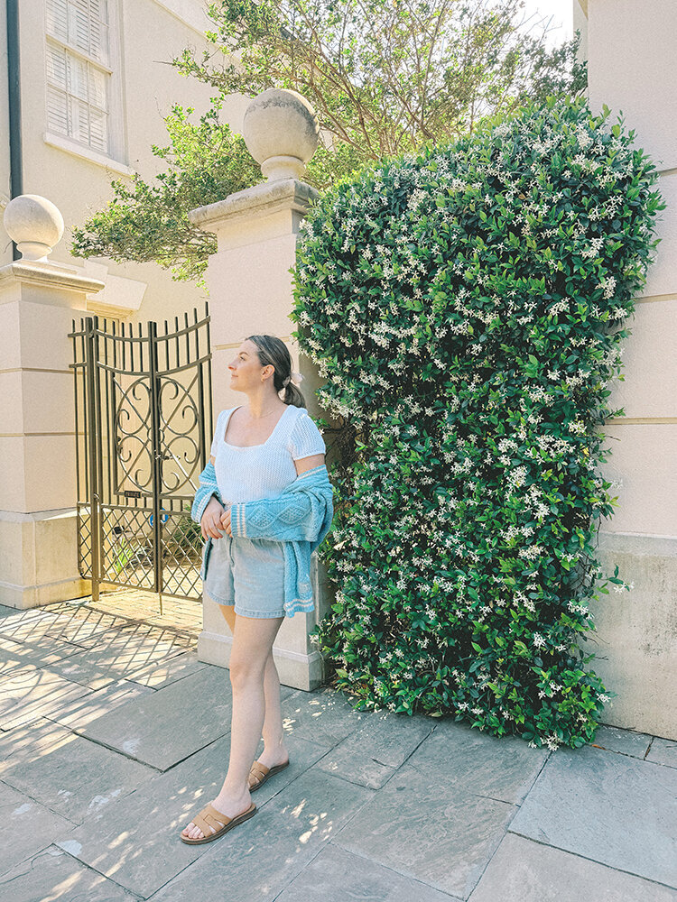 girl on a charleston street with merch