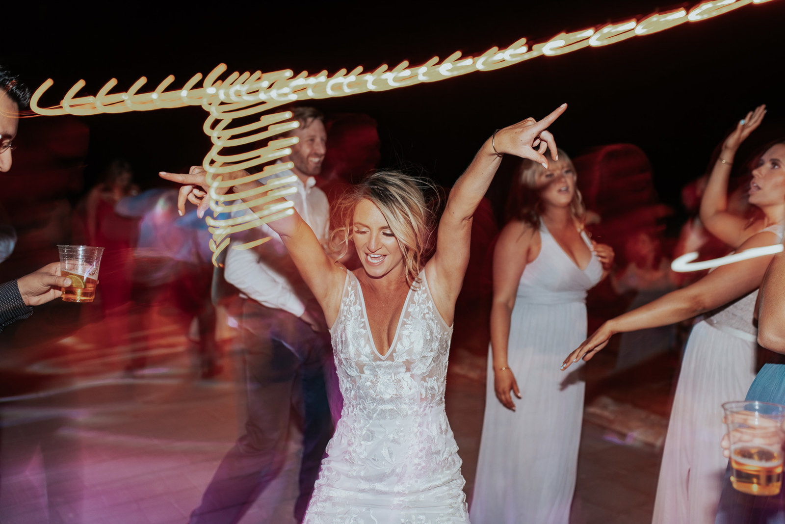 bride dancing and having fun at her wedding, sweetheart winery.