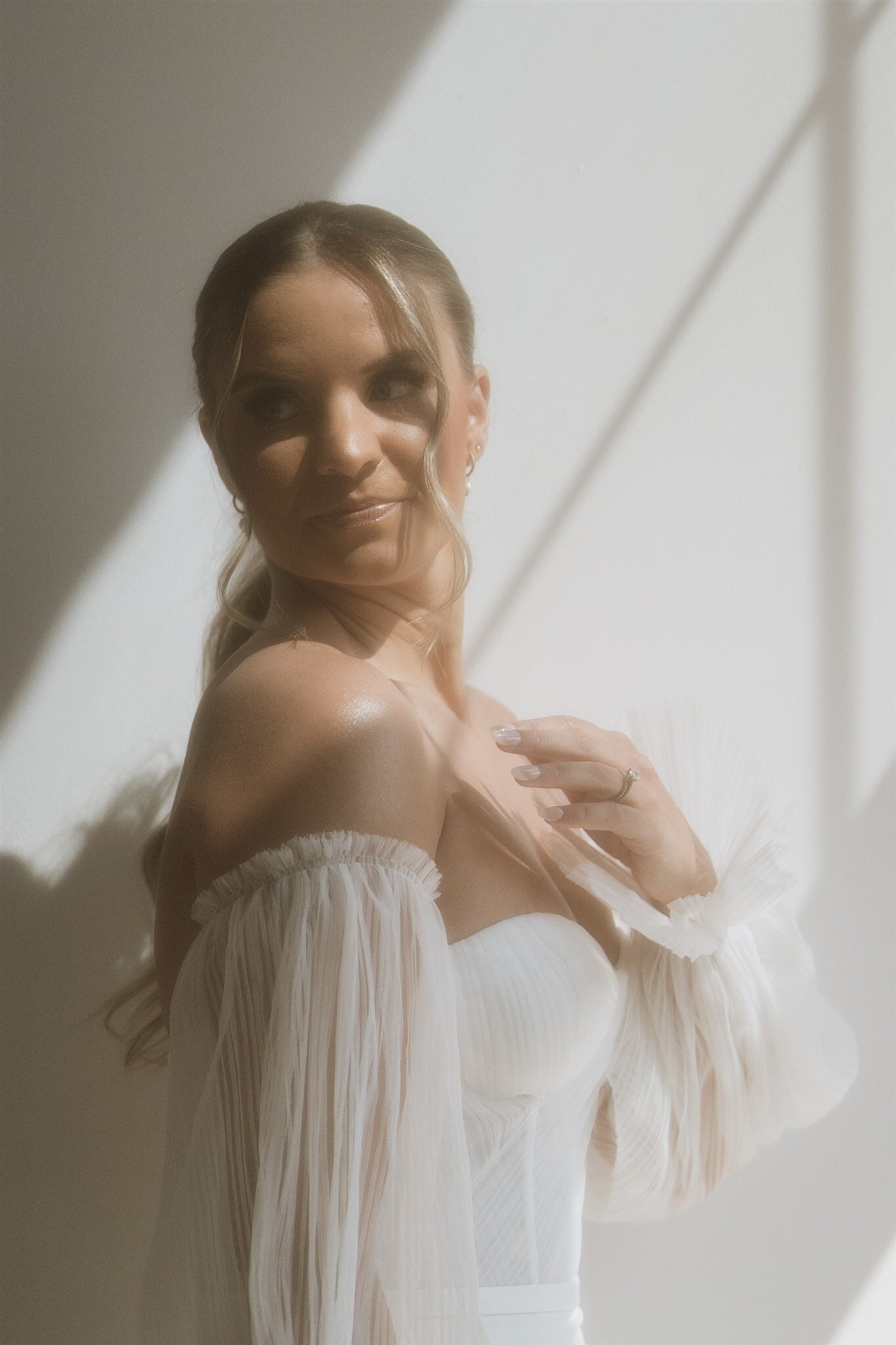 Vintage wedding portrait of bride with window light taken at venue in Minneapolis, Minnesota