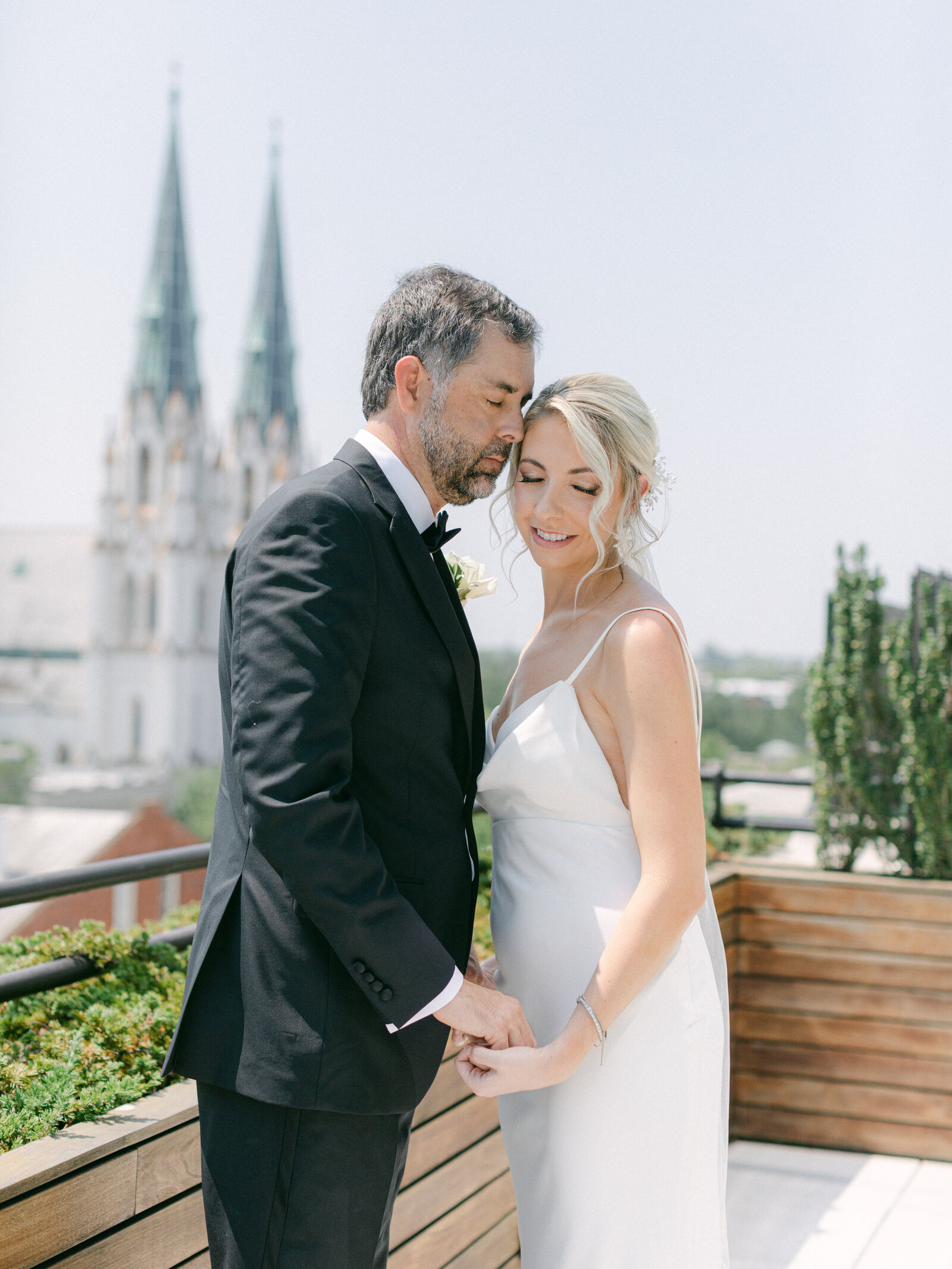 perry lane hotel rooftop savannah ga wedding - couple hugging - torianna brooke portraiture