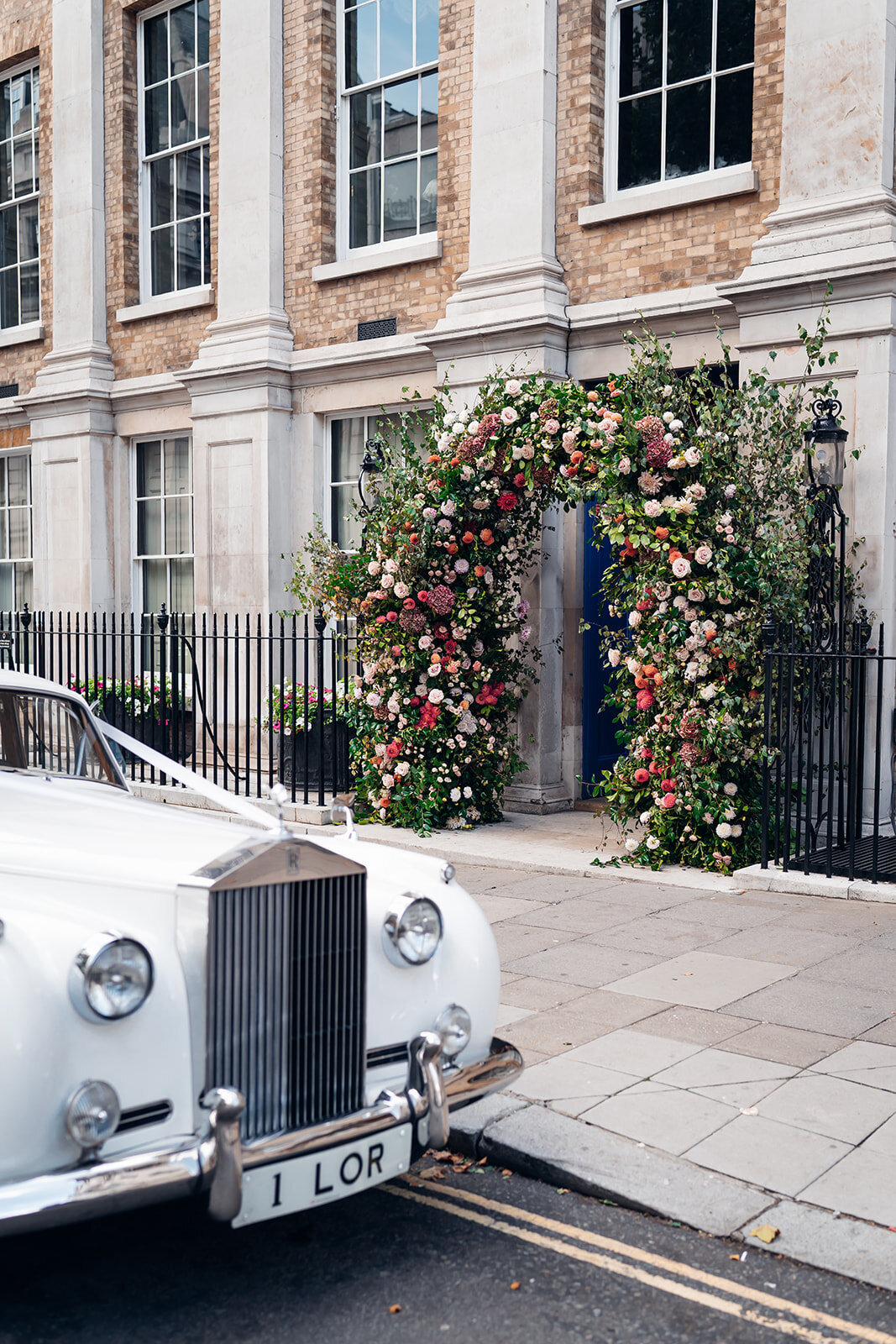 luxe-colourful-floral-archway-with-classic-car