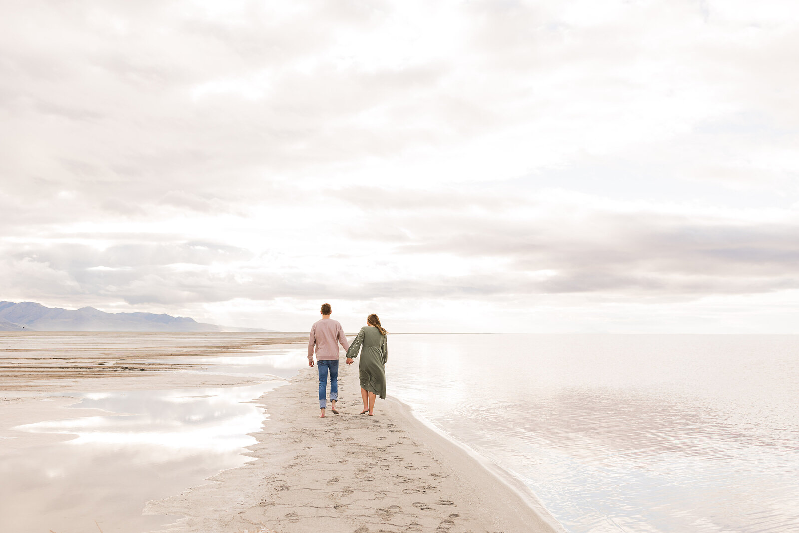 Beautiful scene of couple walking into the distance during their engagement photos taken by Utah Wedding Photographer, Robin.