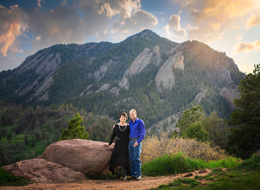 couple-celebrate-25-wedding-anniversary-portrait-mountain-background-NCAR-sunset-loving-celebration-legacy-photography