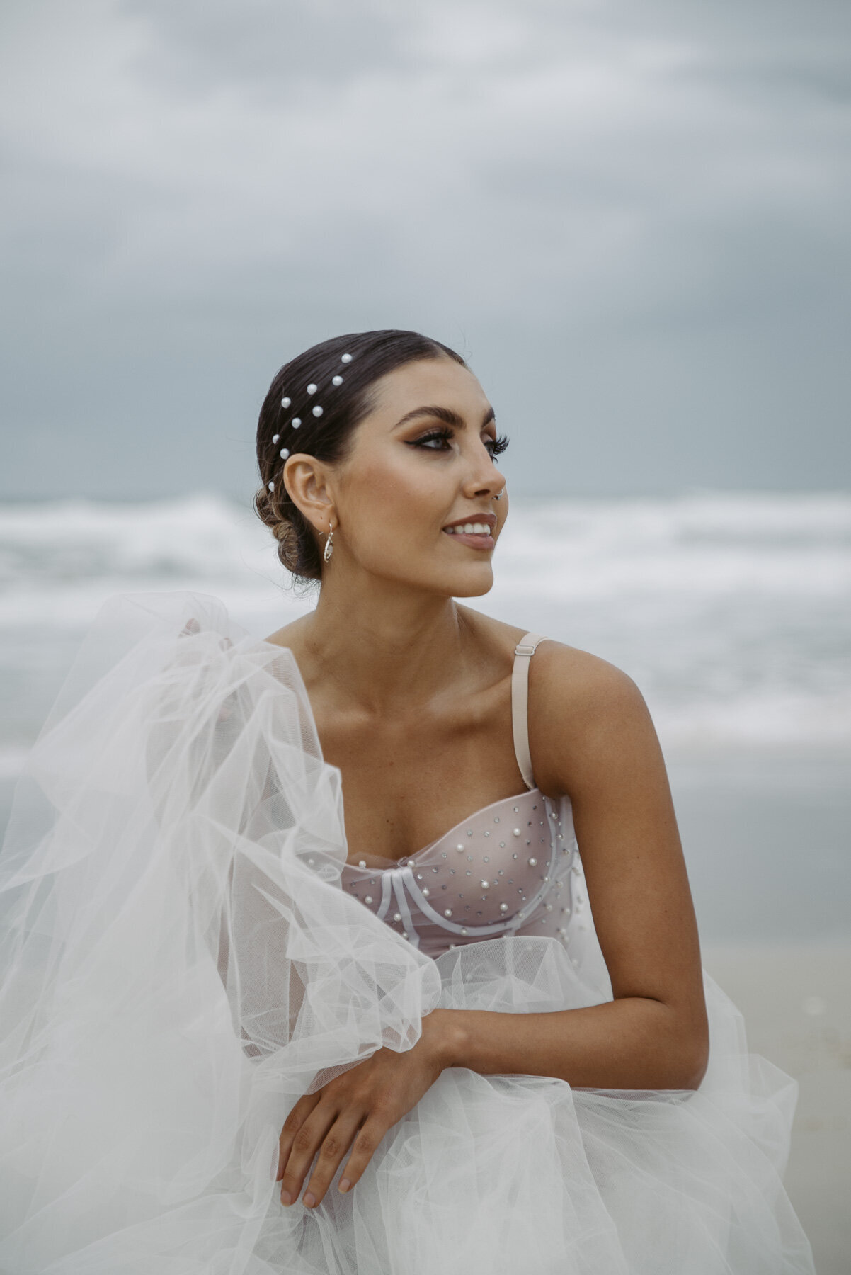 Bella Rae Model shoot sleek twisted bun with pearl hair stickers with bridal glam  makeup  Captured by  Holly K Photography