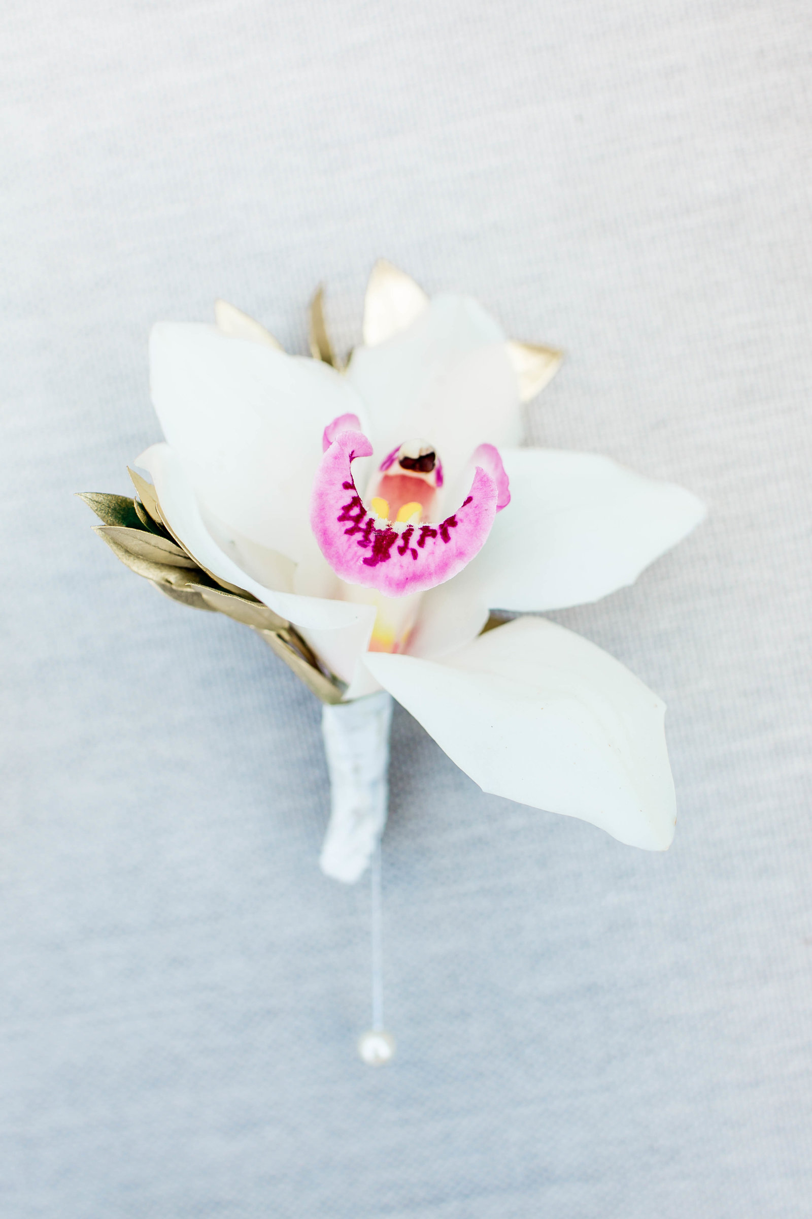 Boutonniere has orchid pinned, Grand Bohemian, Charleston, South Carolina