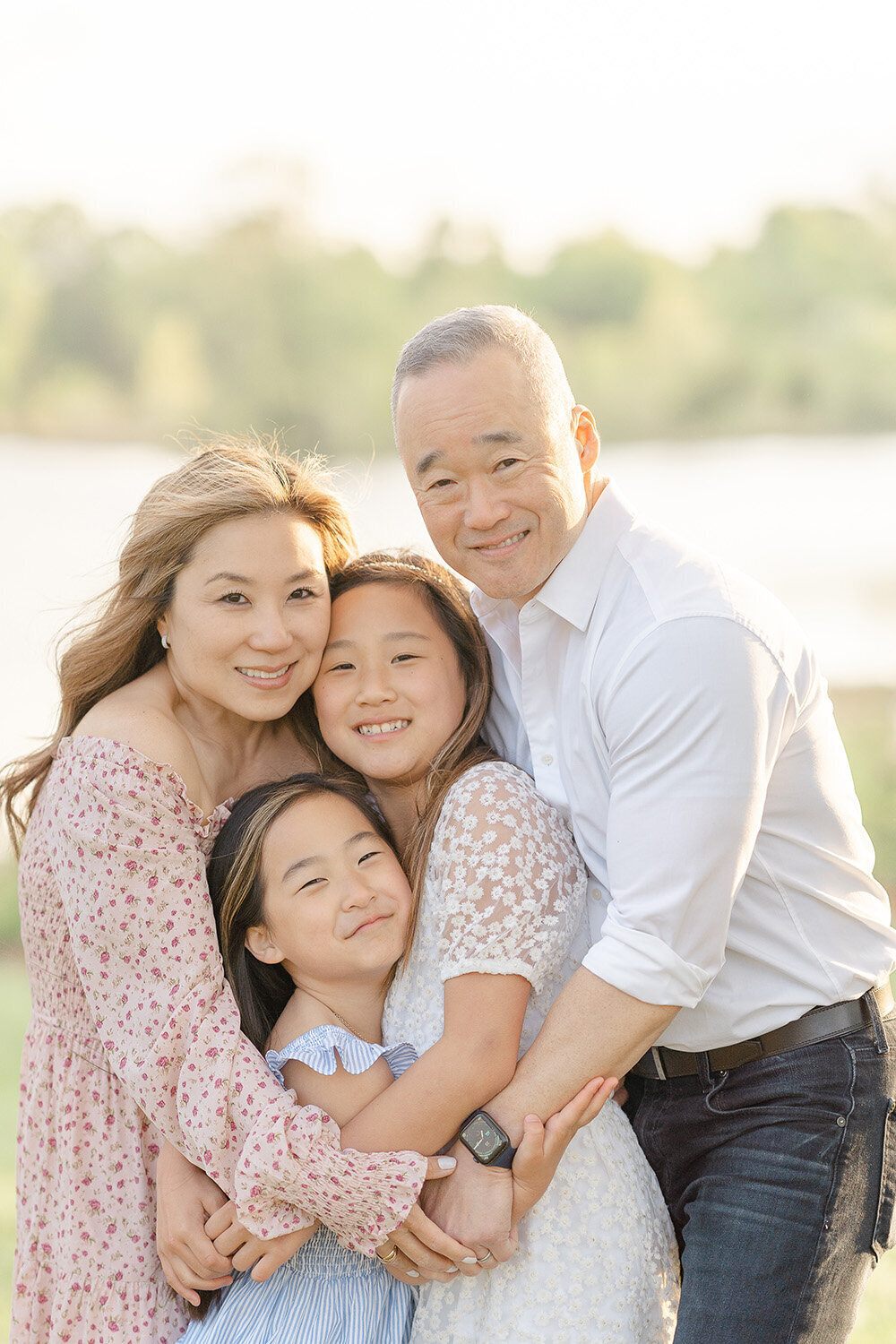 family hugging with big smiles during  spring minis in Woodbridge, VA