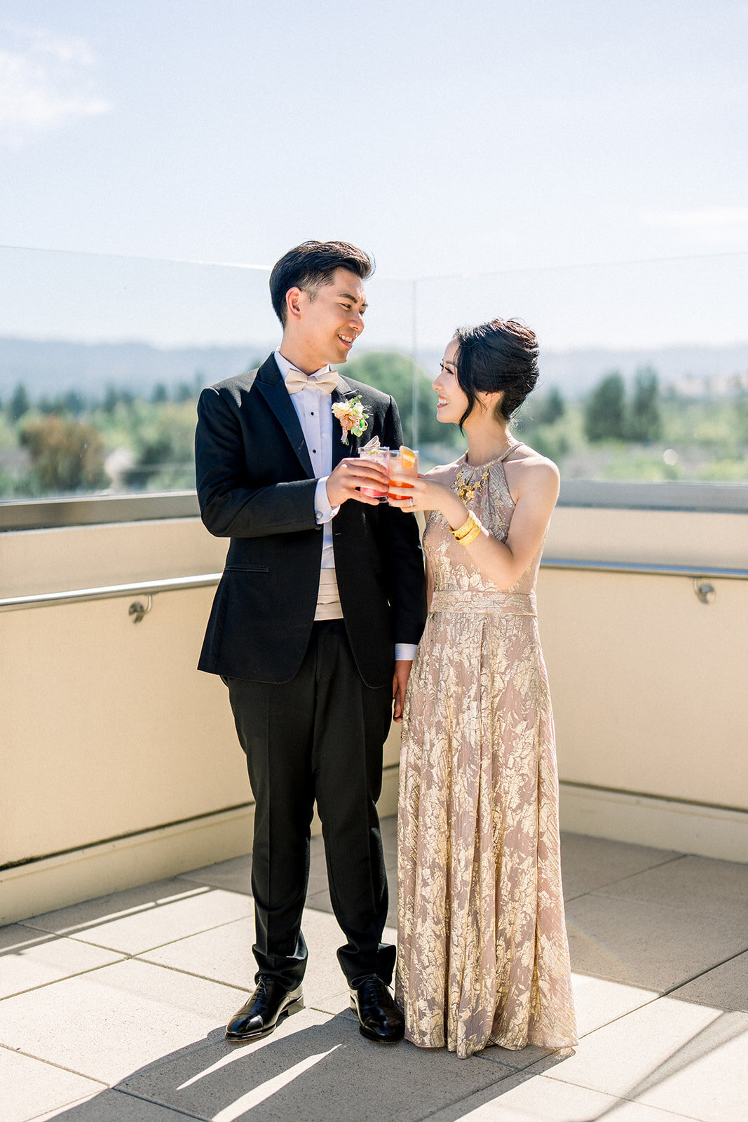 The bride and groom share a celebratory toast during their luxurious wedding reception at Filoli in Woodside, California.