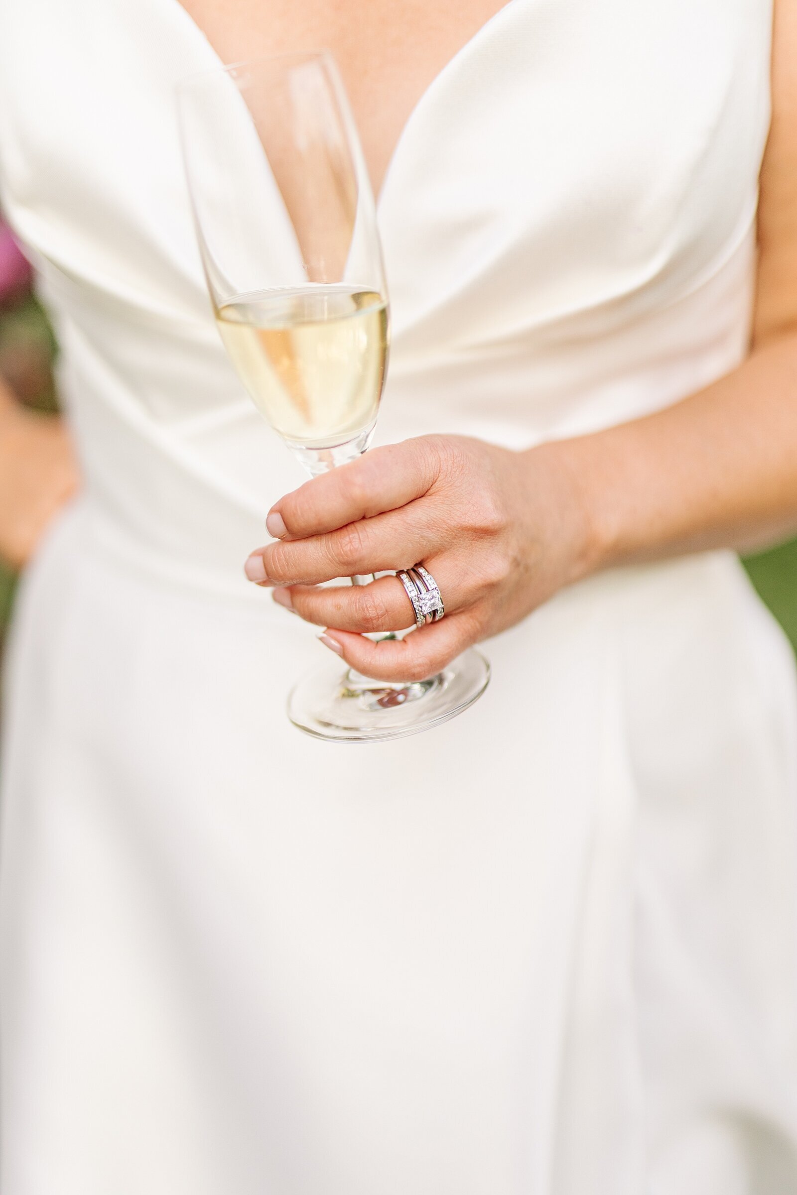 Bride holding champagne glass at the Park Hyatt Aviara in Carlsbad, California.