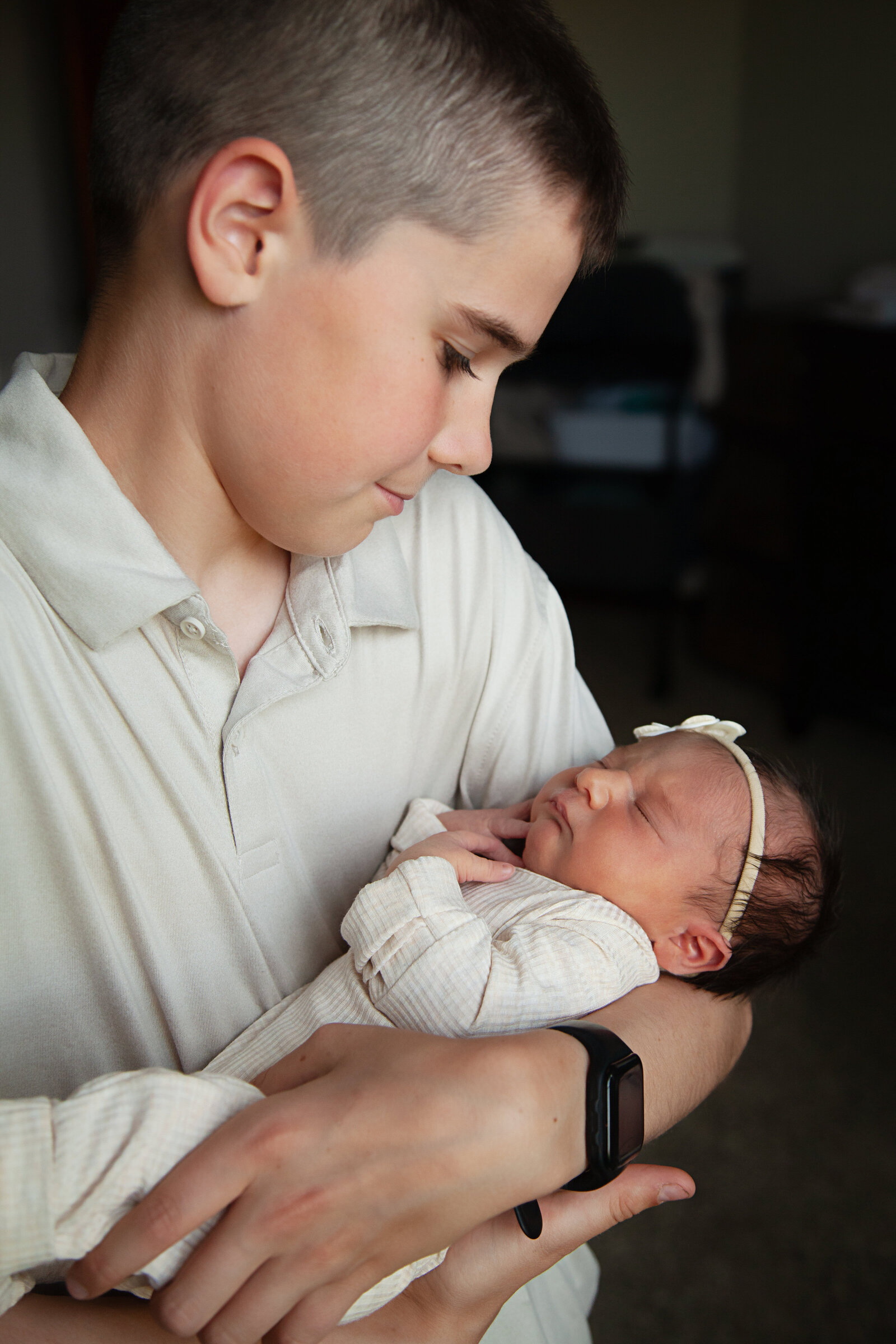 Babu girl in her big brother's arms.