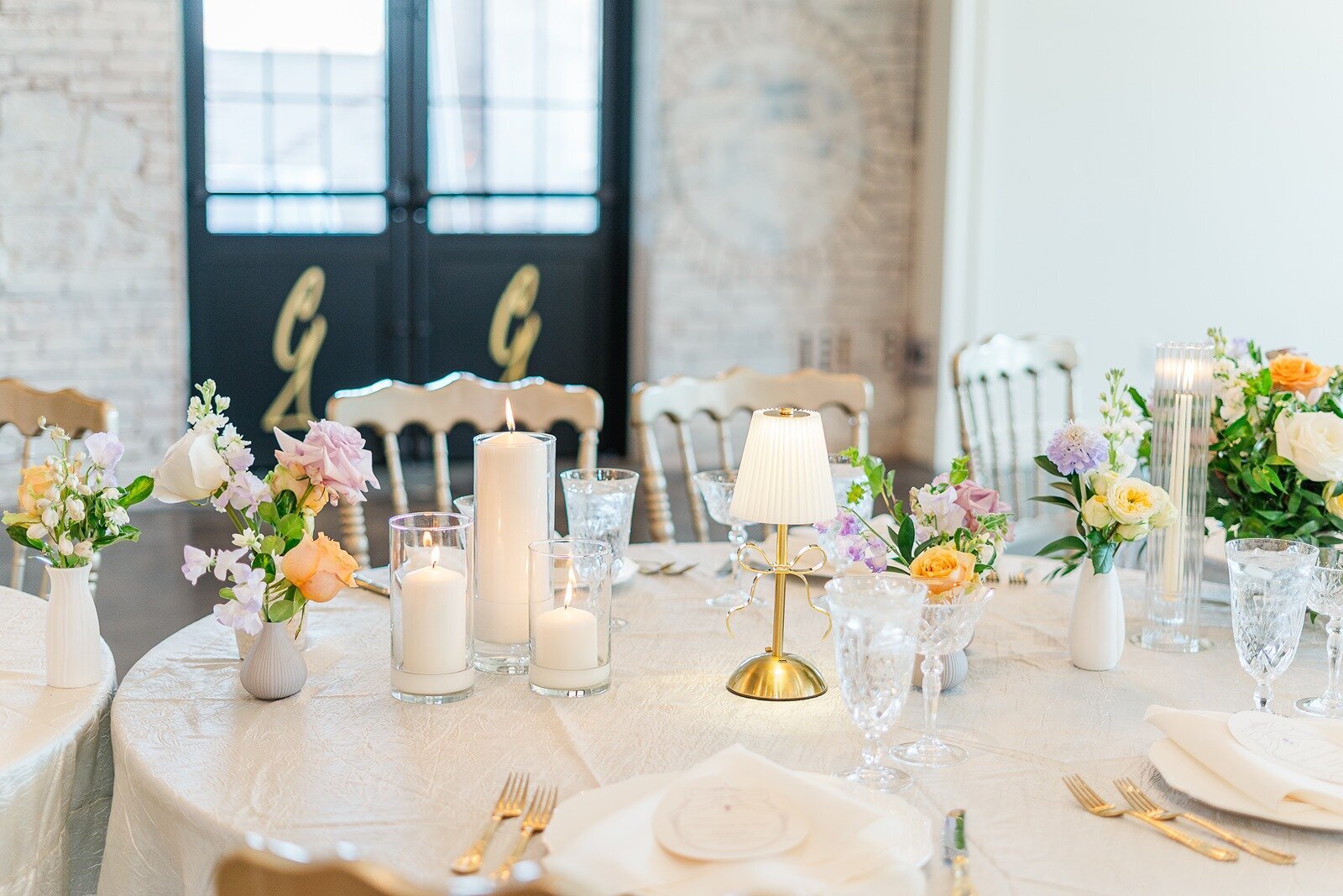 elegant table settings in the luxe room at grbic events wedding venue in st. louis