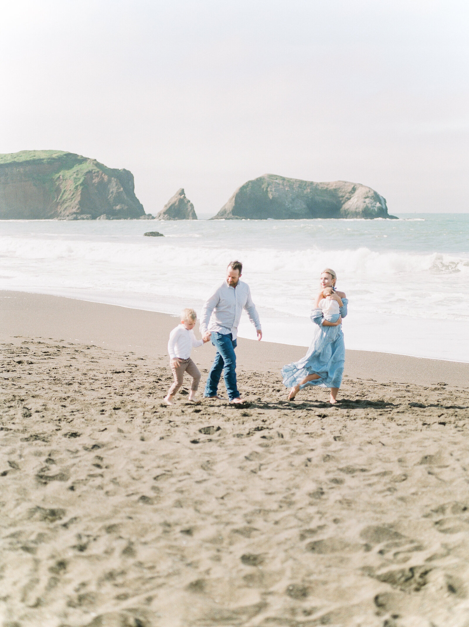 family at the beach with new baby by Orlando family photographer