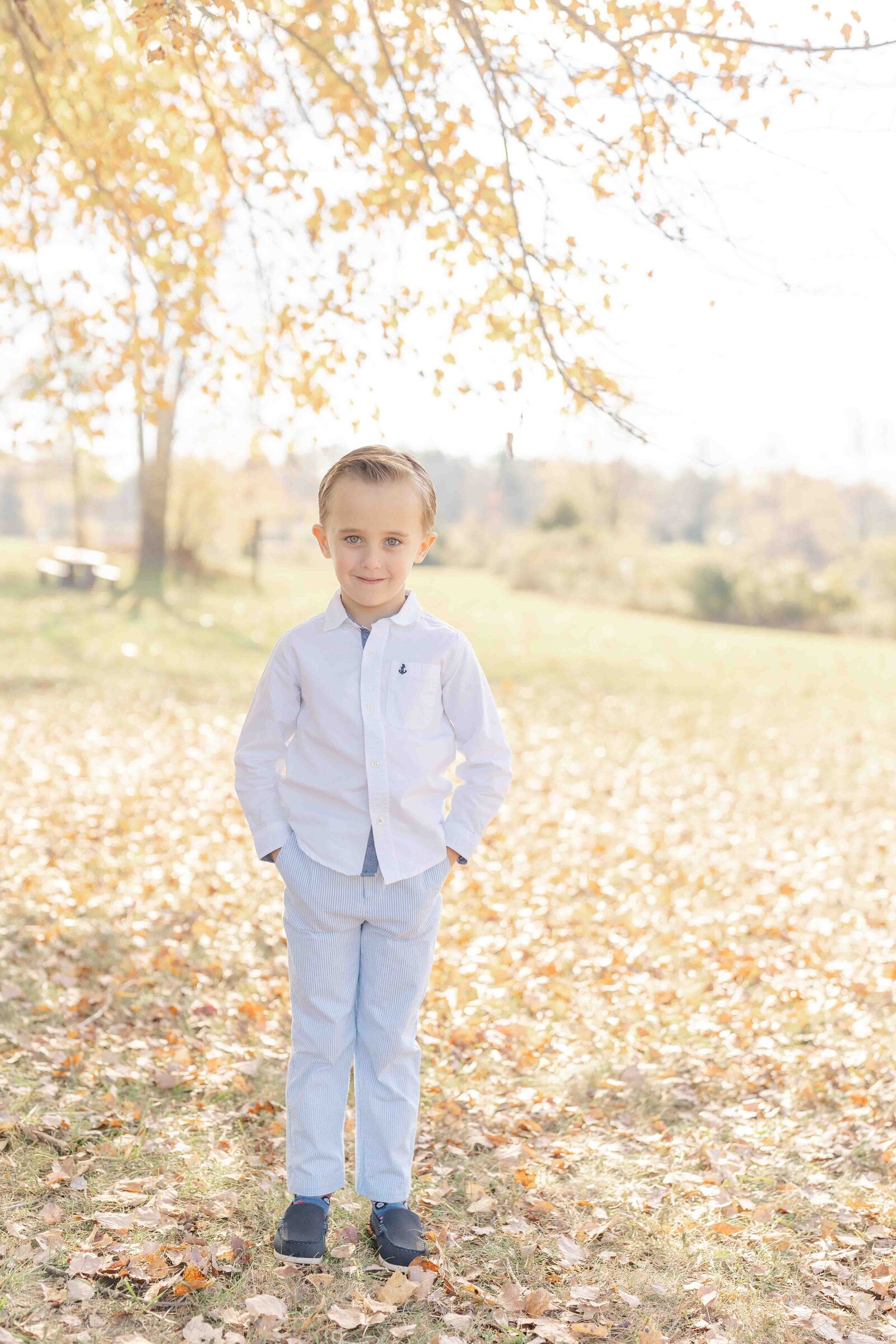 boy posing for photo during fall minis in Haymarket, Virginia