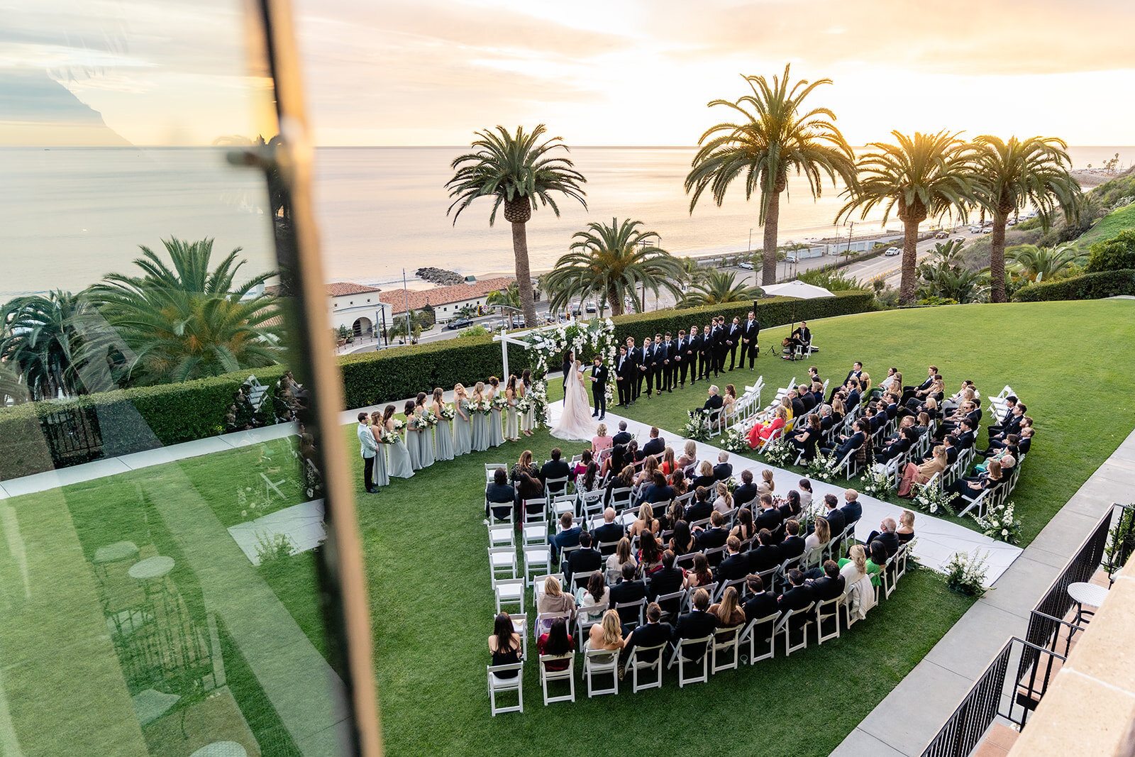 Wide angle view of a wedding ceremony with ocean views at The Bel Air Bay Club.