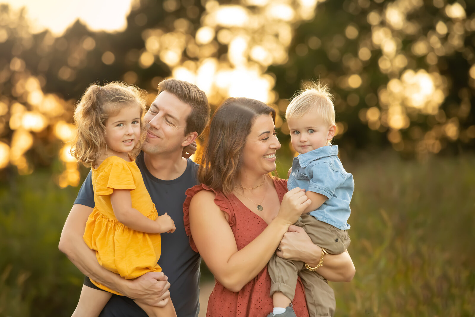 Cute young family during portrait session at golden hour in Raleigh NC.