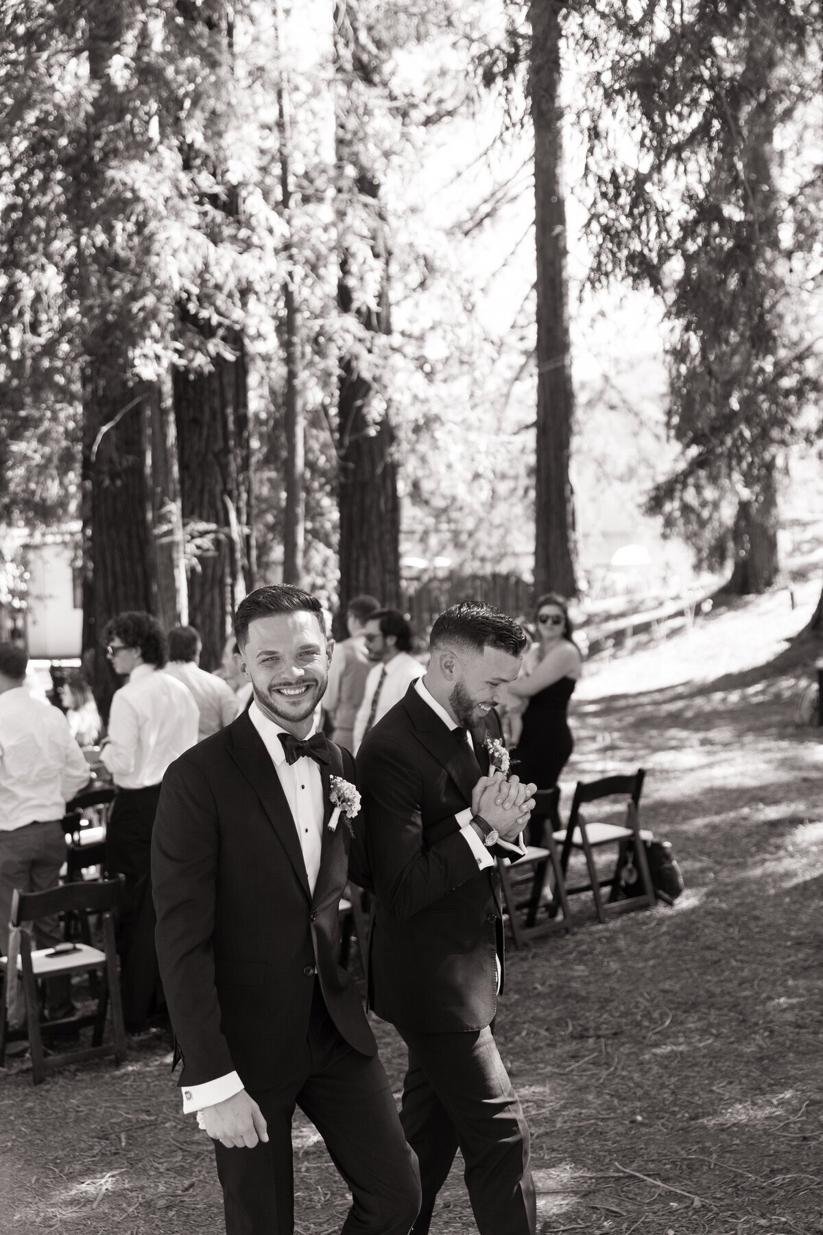 Groom smiling at camera by destination wedding photographer