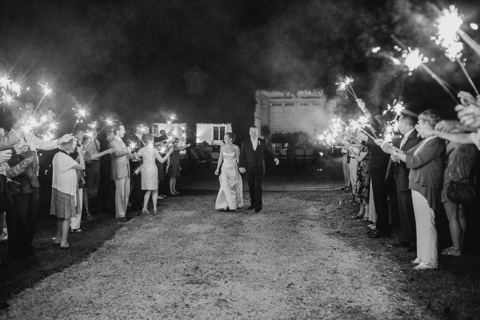 Bride and groom have sparkler exit, Old Wide Awake Plantation, Charleston, South Carolina