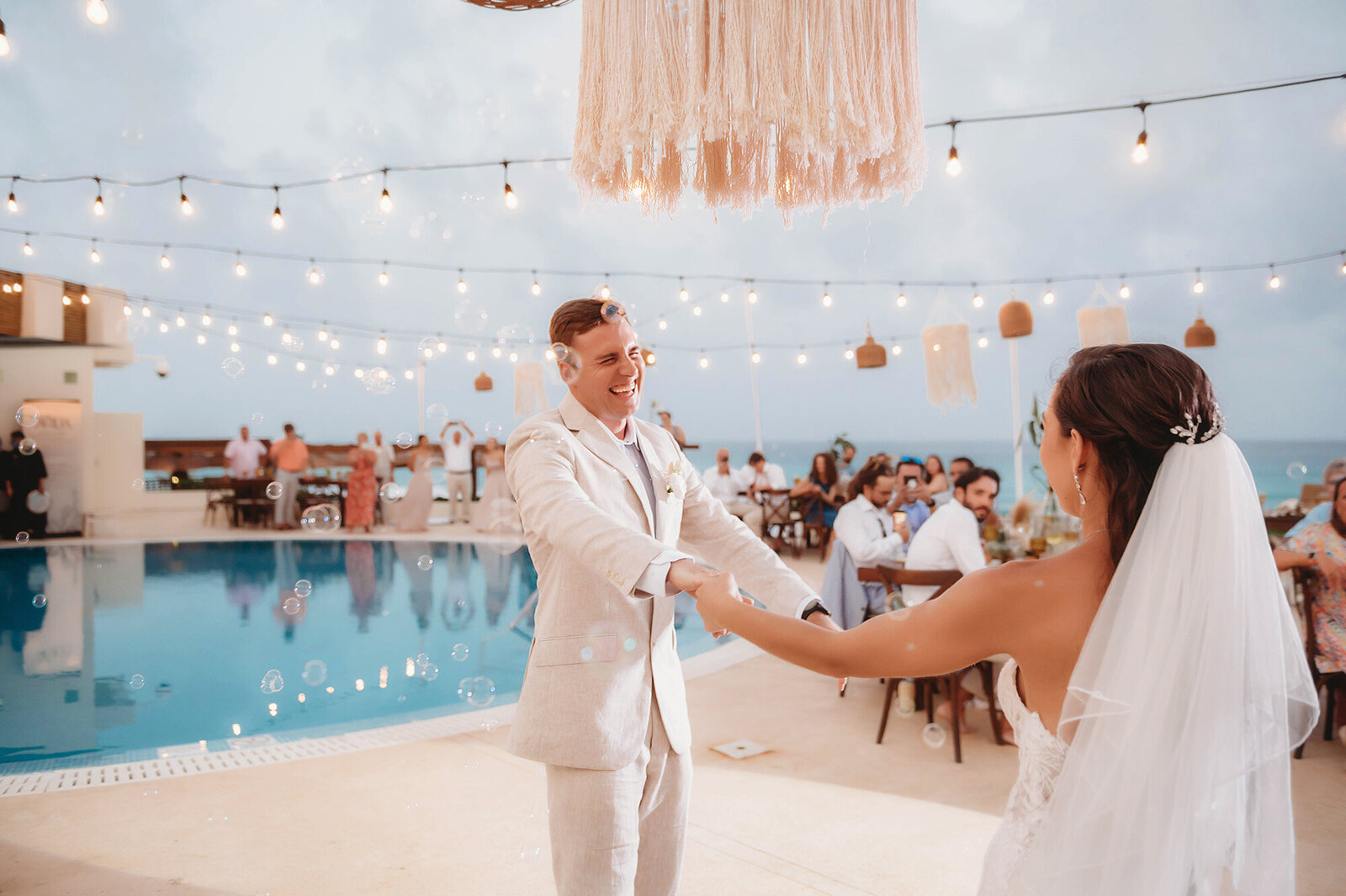 Newlyweds dance during their Micro-Wedding Reception at Live Aqua Resort in Cancun, Mexico.