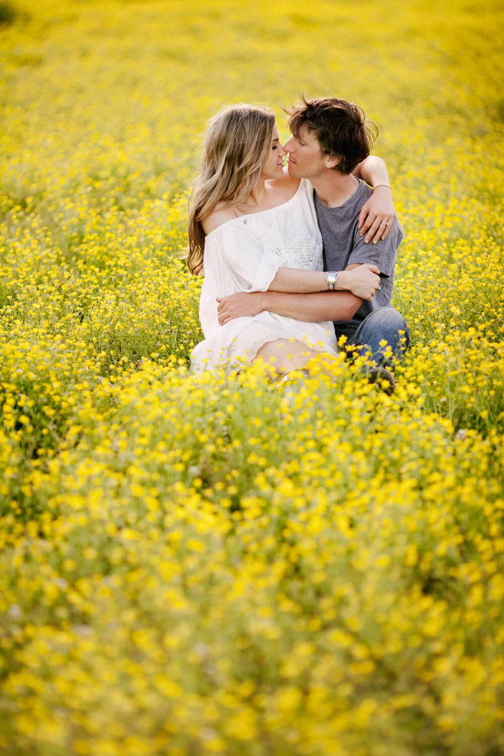 engaged couple flower field