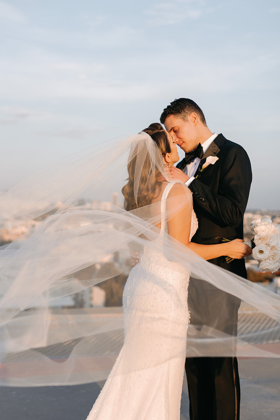 timeless wedding photo of bride and groom kissing
