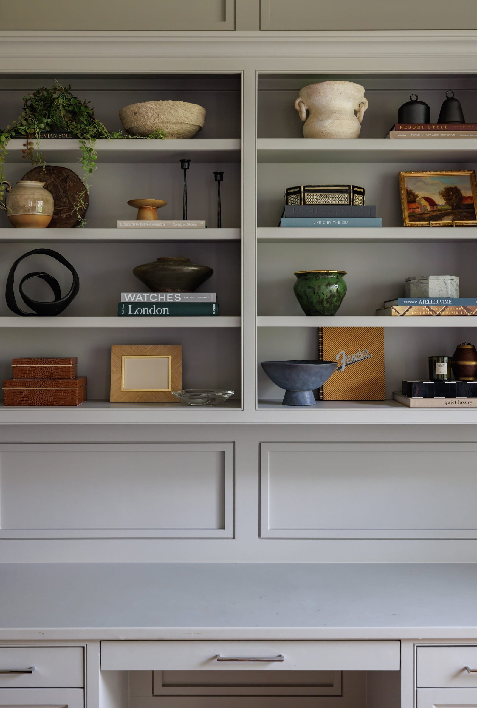 vision and hammer styled shelves on light gray built-ins