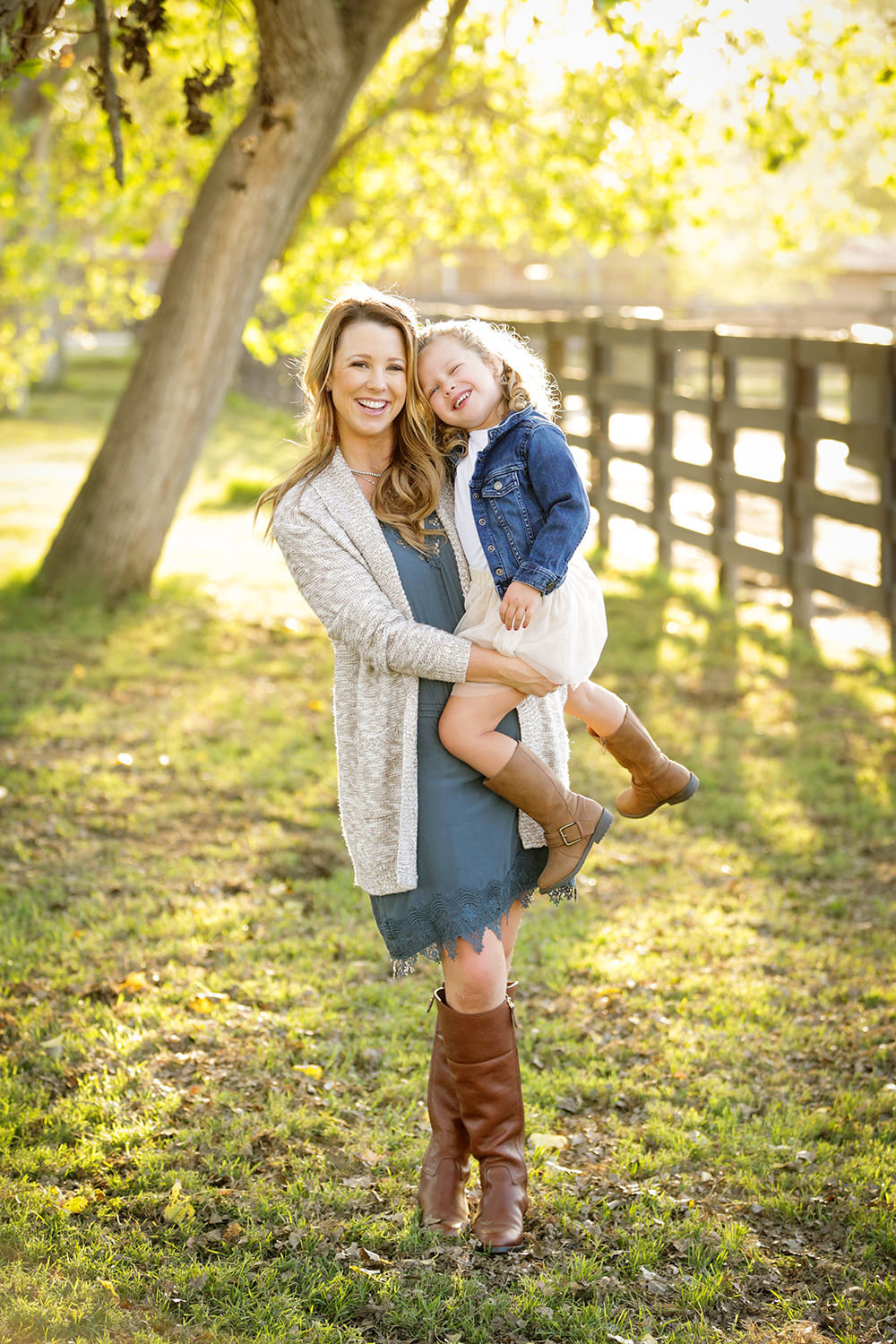 san diego family photographer | family in a field with leafs and fall colors outdoors smiling
