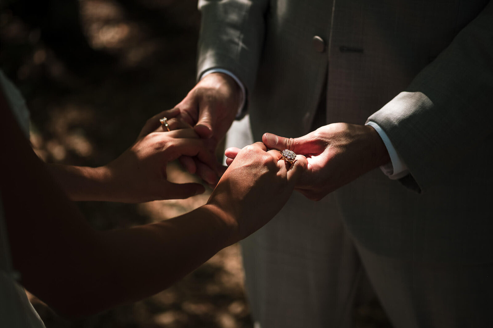 Bride and groom holding hands.