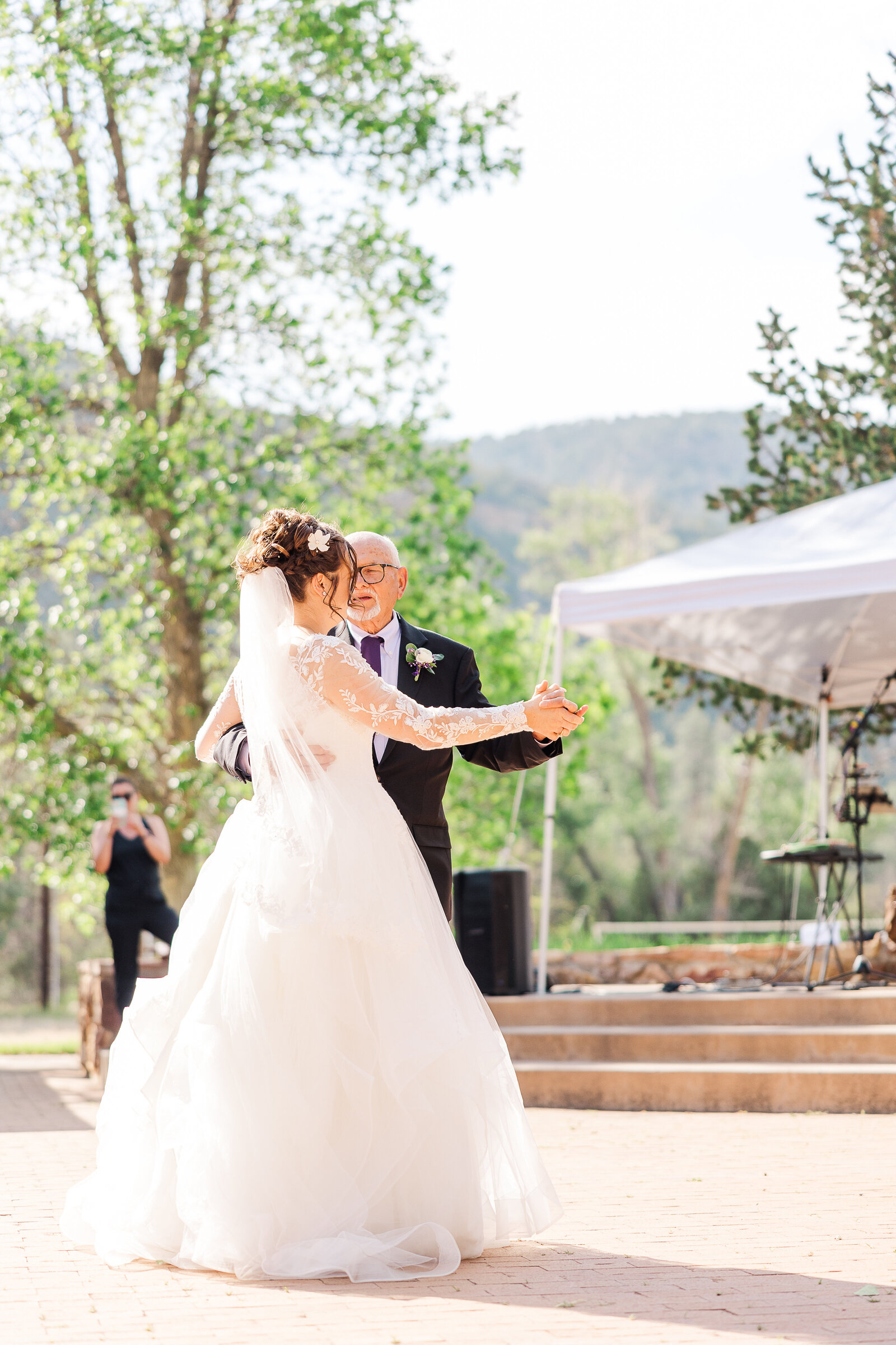 Bride and her father sharing a special dance together during the wedding reception at Ridgway State Park
