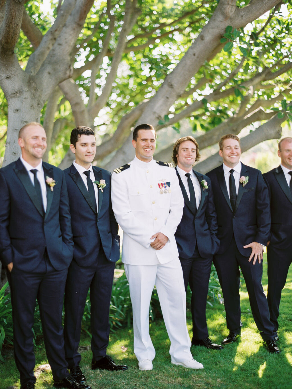 Groom dressed in dress whites with his groomsmen at San Diego wedding