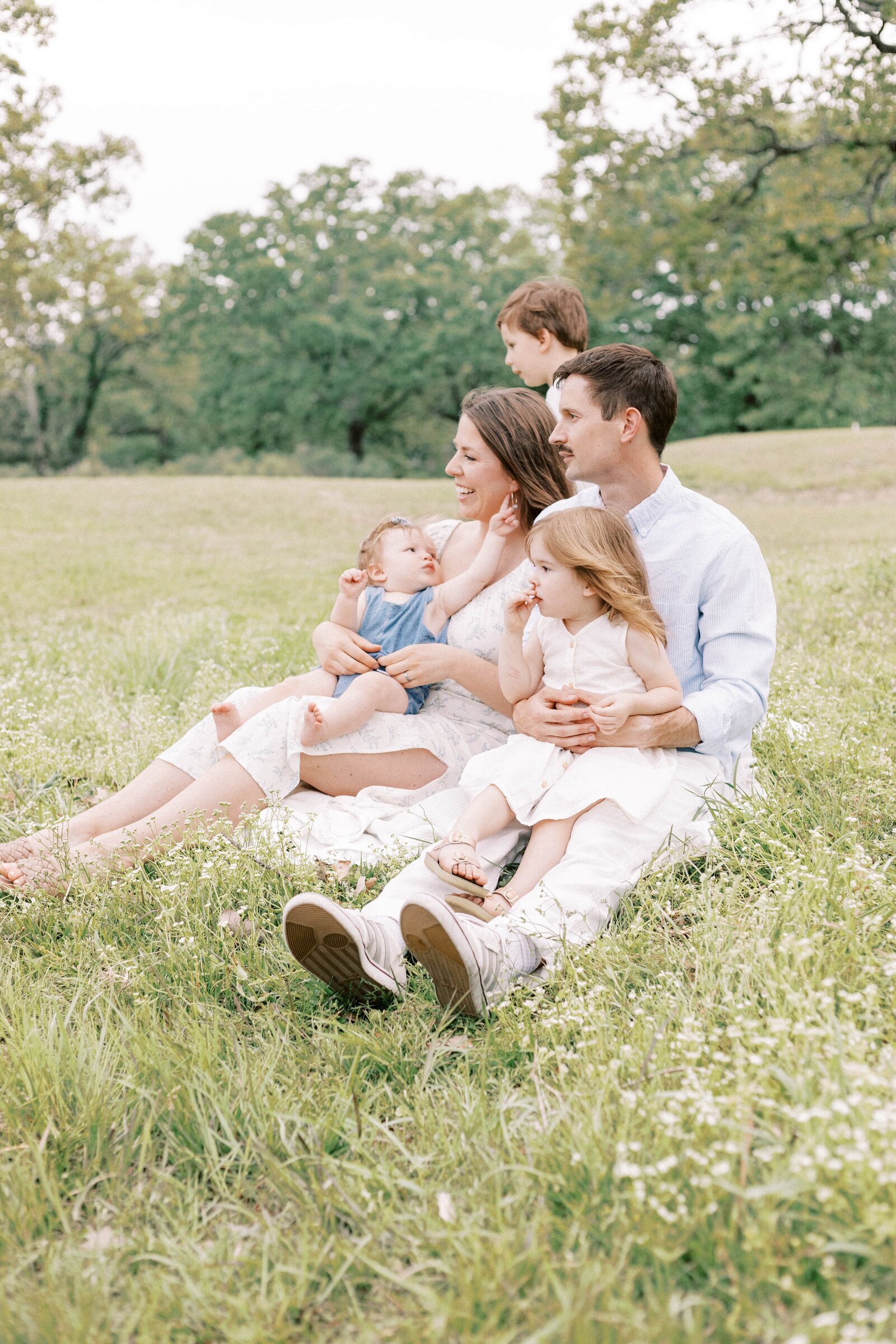 family sitting during family photos in peoria illinois 