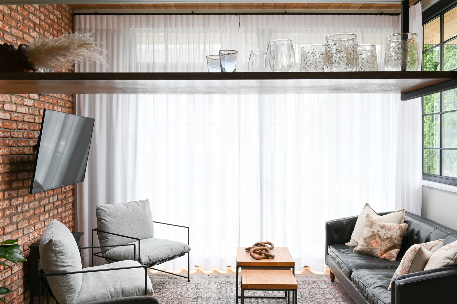 Align Interior Design living room windows black sofa