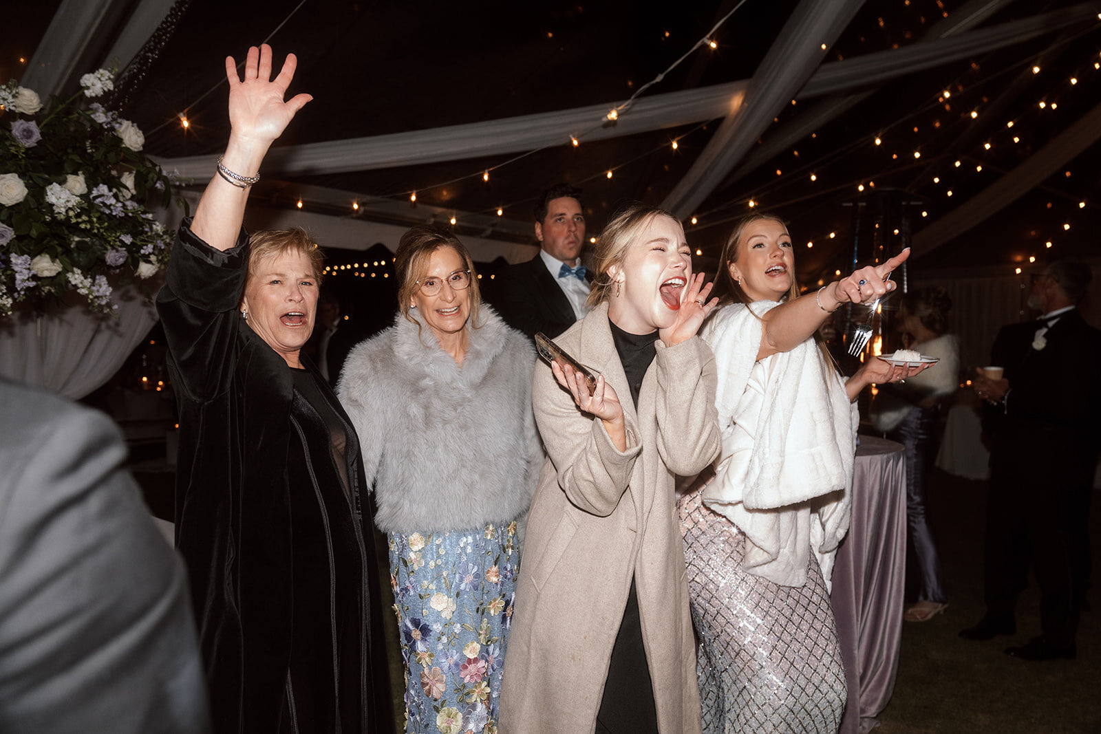 Wedding guest celebrating at on dance floor