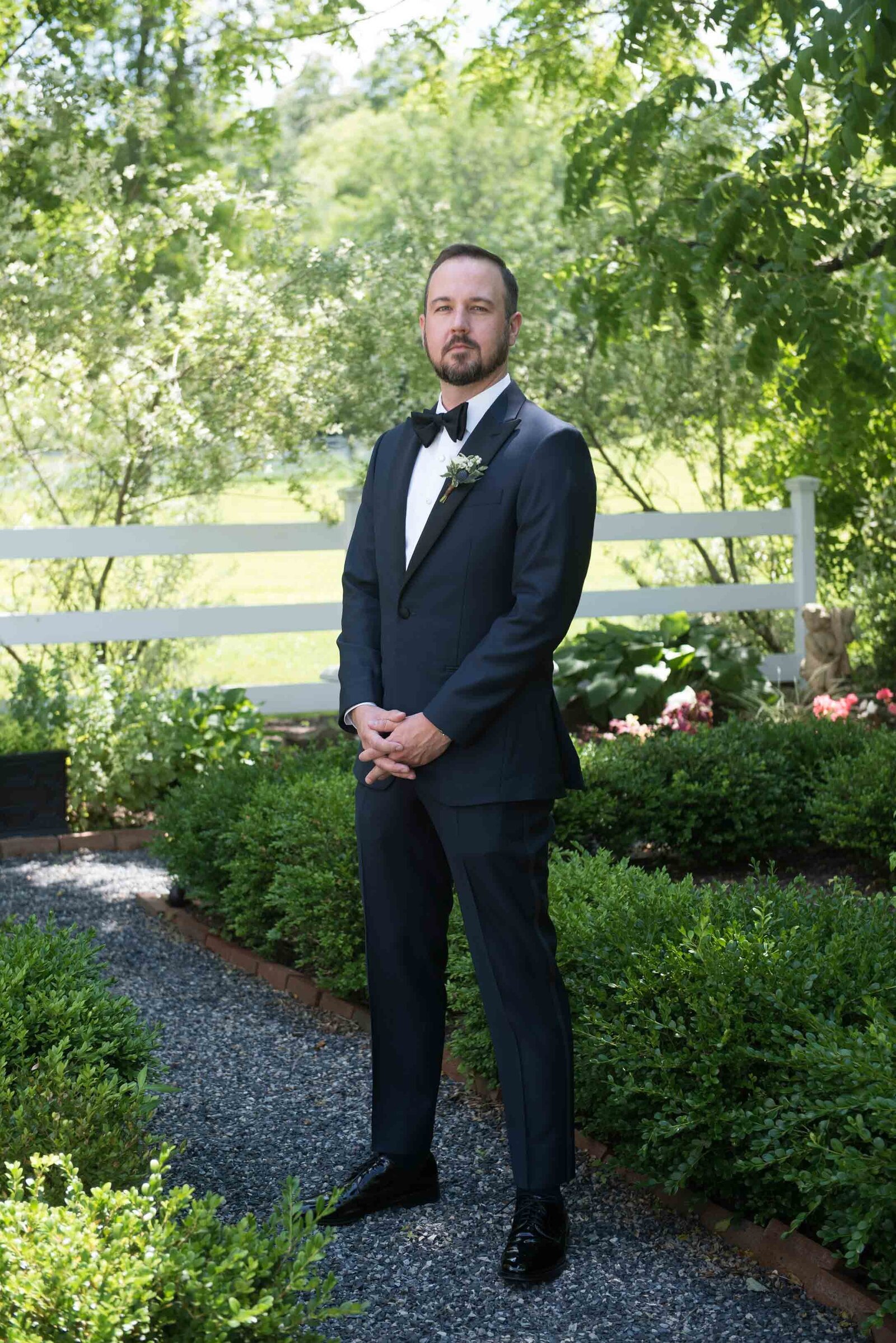 Groom standing on gravel walkway at Private Estate Wedding New Hope Pennsylvania 