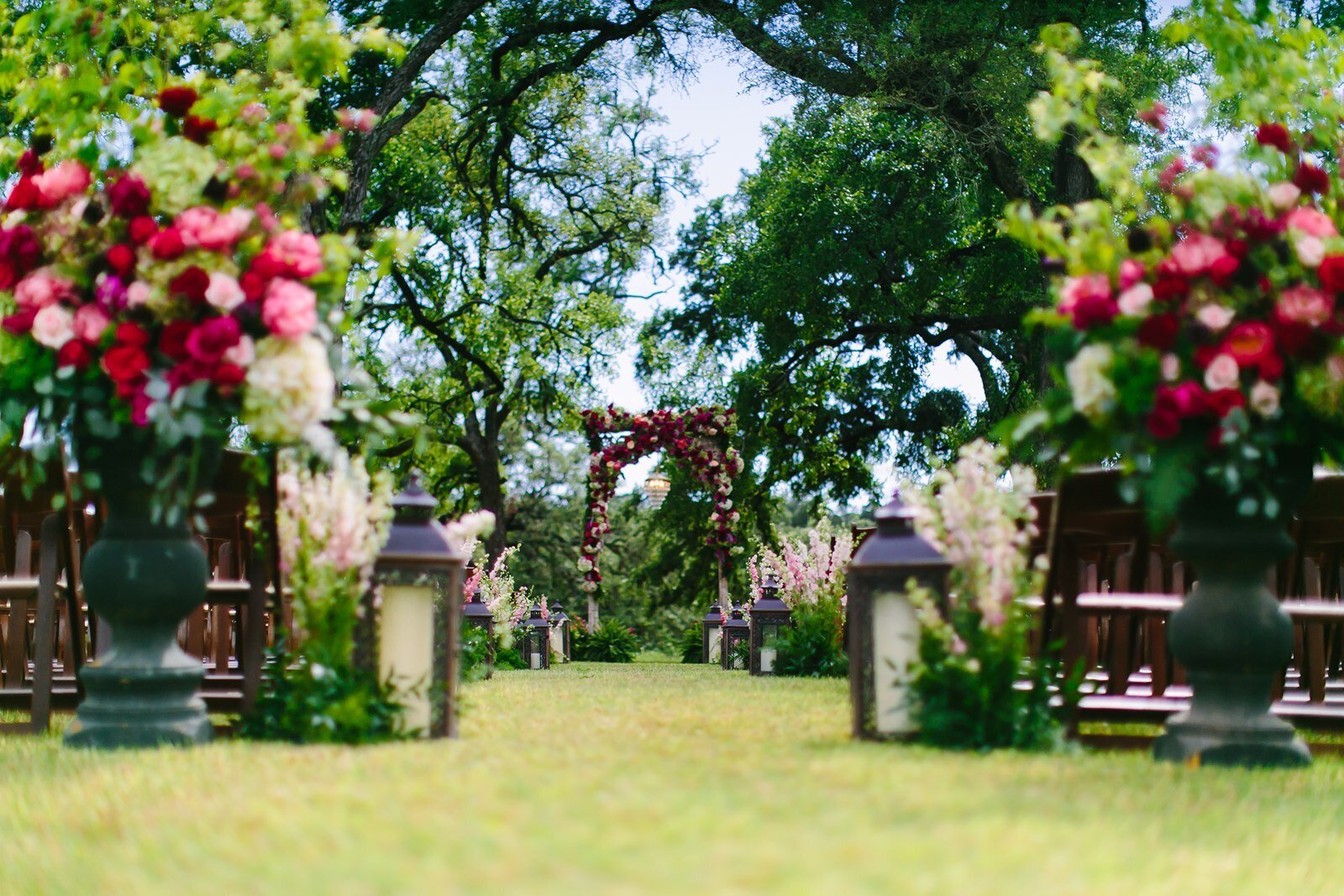 ceremony-aisle-red-flowers-texas-venue